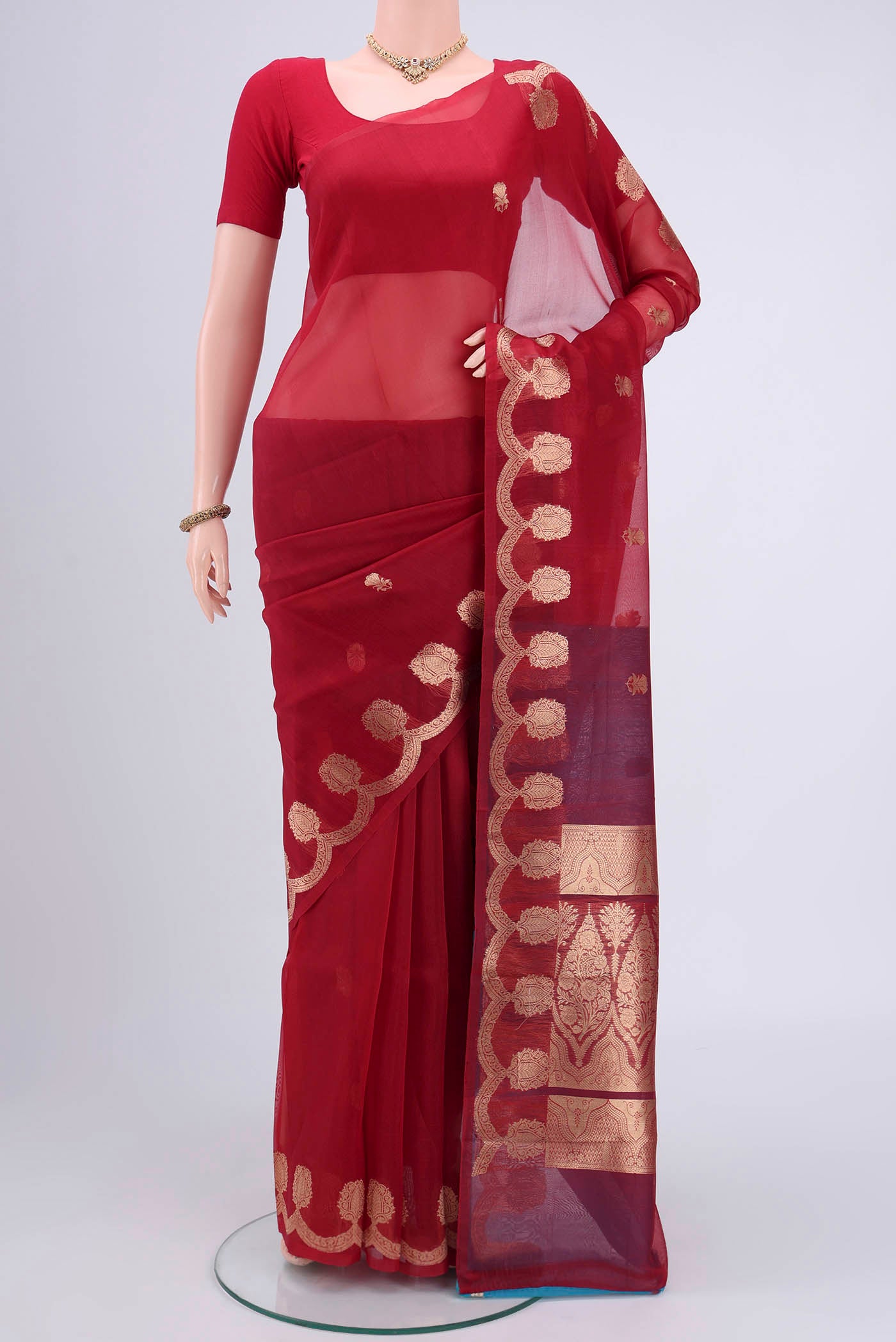 Red Organza Silk Saree with Plain Body and Zari Border.  displayed on a mannequin