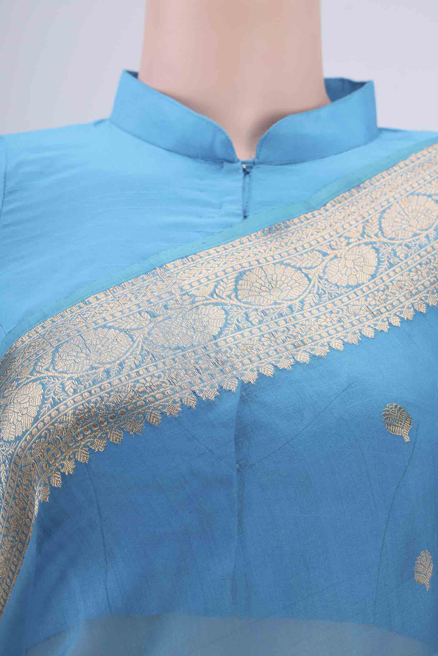 Border image of Blue Organza Silk Saree with Zari Butta on the body and Zari Border. 