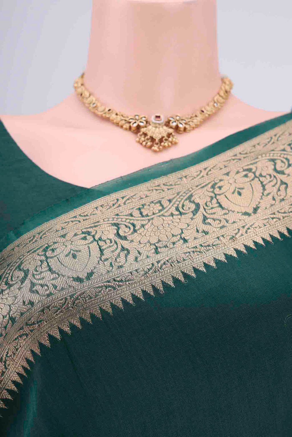 Border image of Bottle Green Organza Silk Saree with Plain Body and Zari Border. 