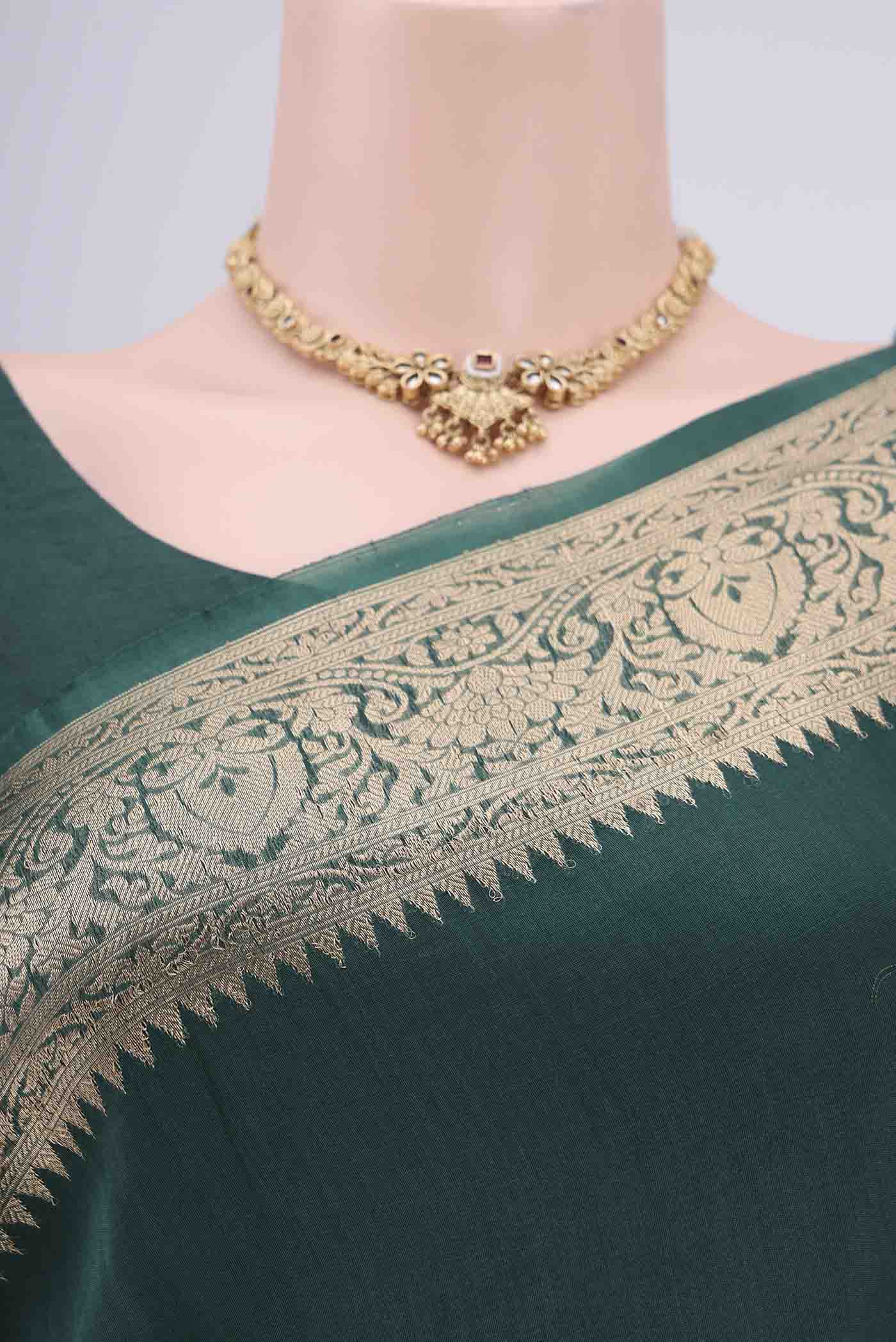 Border image of Bottle Green Organza Silk Saree with Plain Body and Zari Border. 