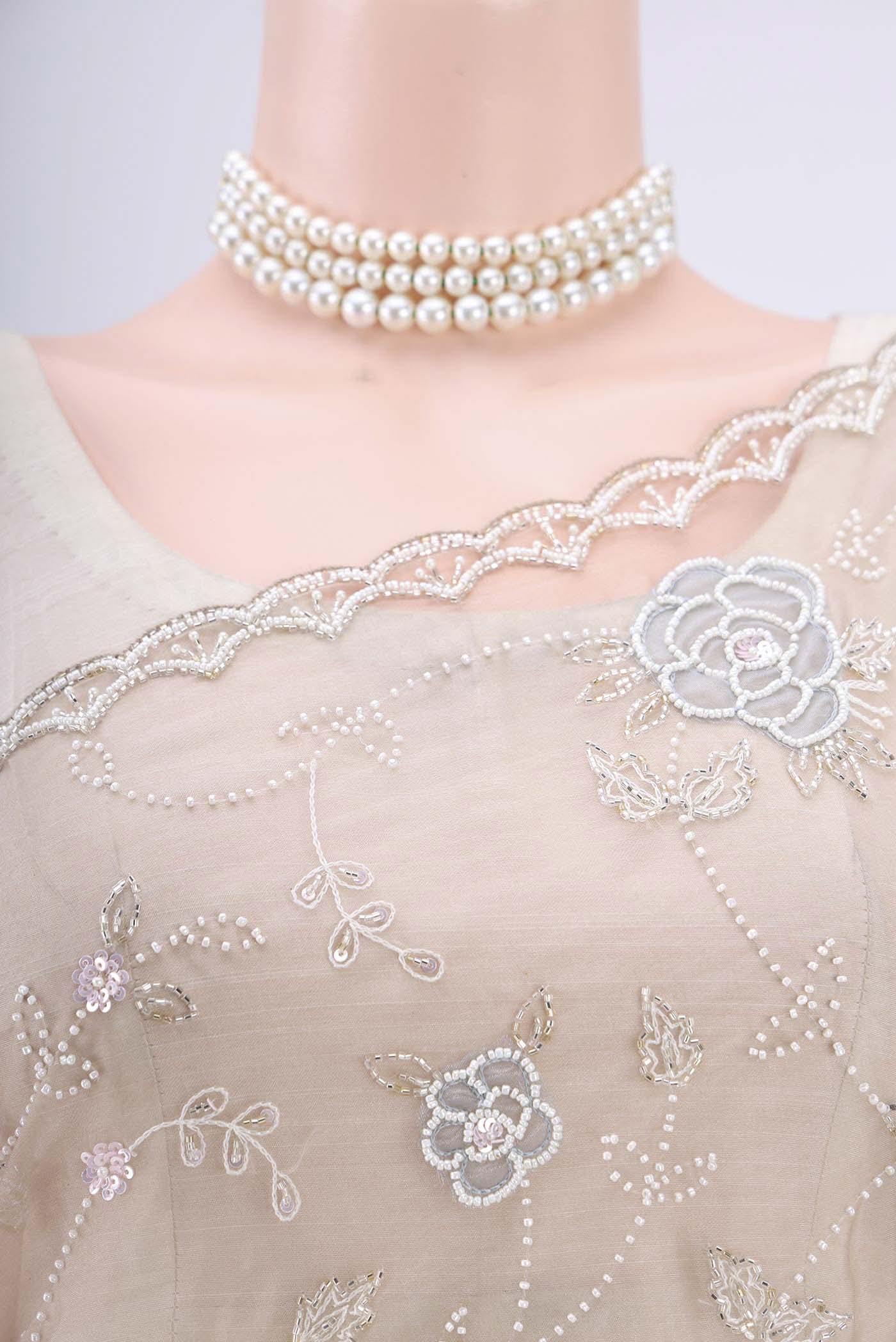 Border image of Dark Beige Organza Silk Saree with Embroidery on the body and Zari Border. 