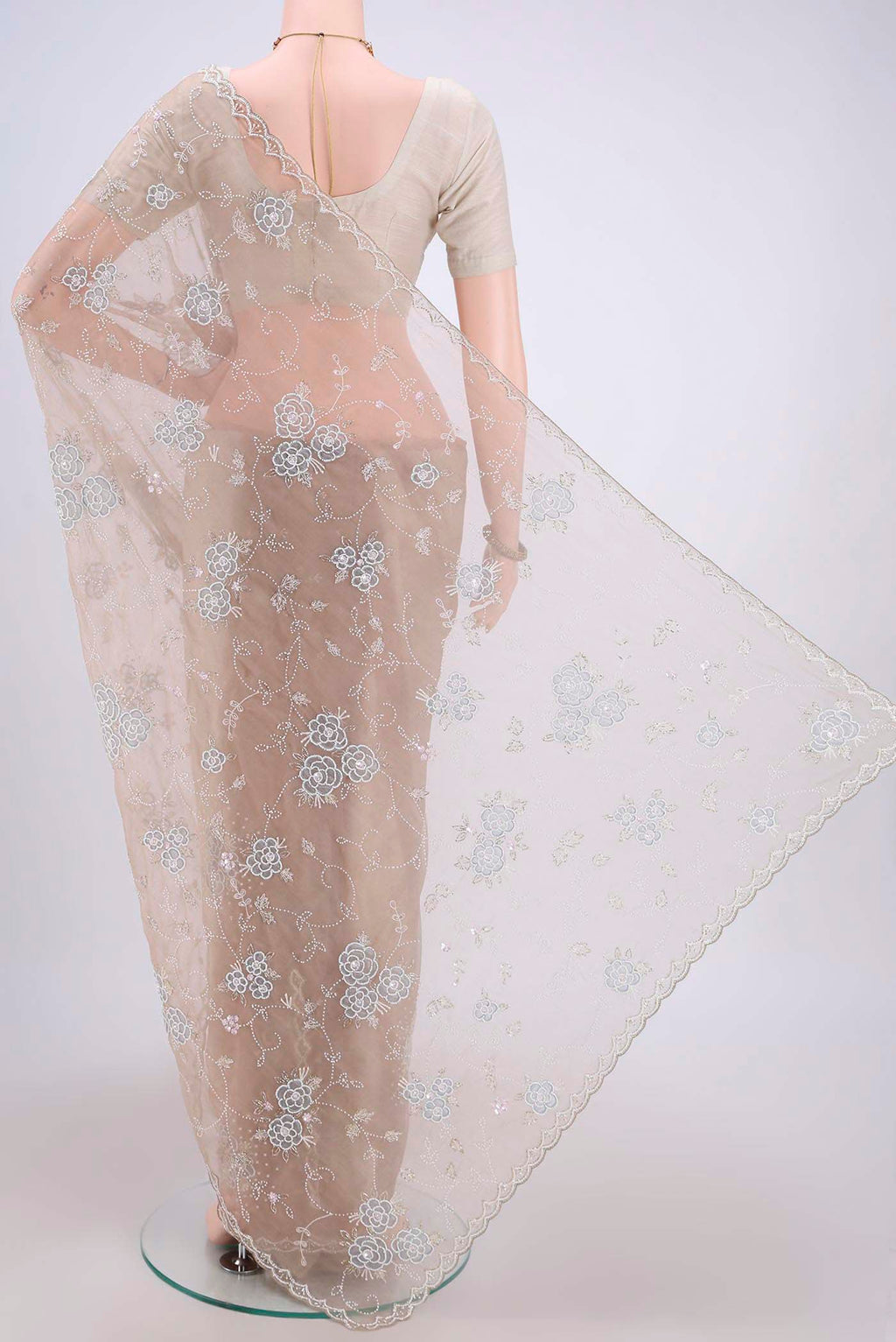 Flat view of Dark Beige Organza Silk Saree with Embroidery on the body and Zari Border. 