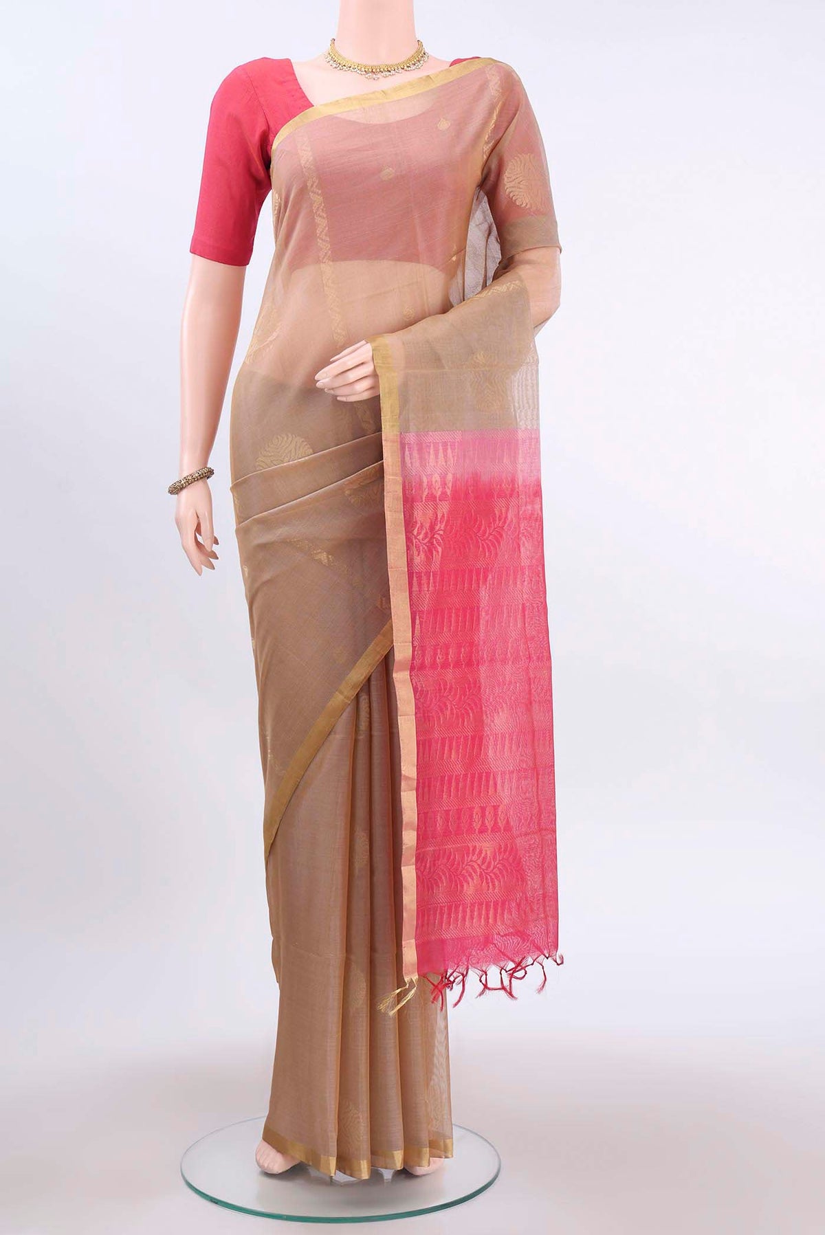 Dark Beige Kora Cotton Saree with Zari Butta on the body and Zari Border displayed on a mannequin