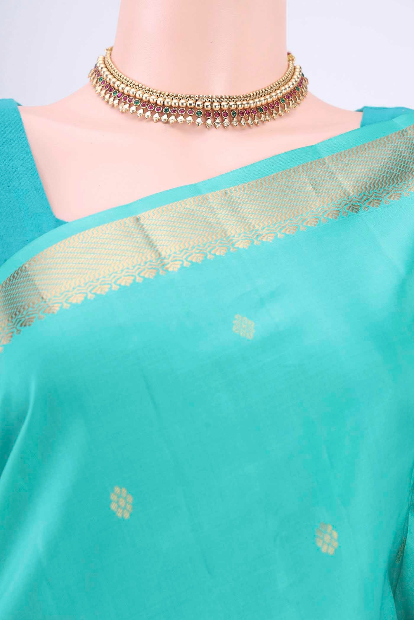 Border image of Turquoise Kanchipuram Silk Saree with Zari Butta on the body and Zari Border
