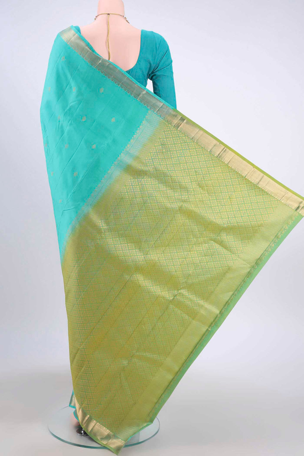 Flat view of Turquoise Kanchipuram Silk Saree with Zari Butta on the body and Zari Border