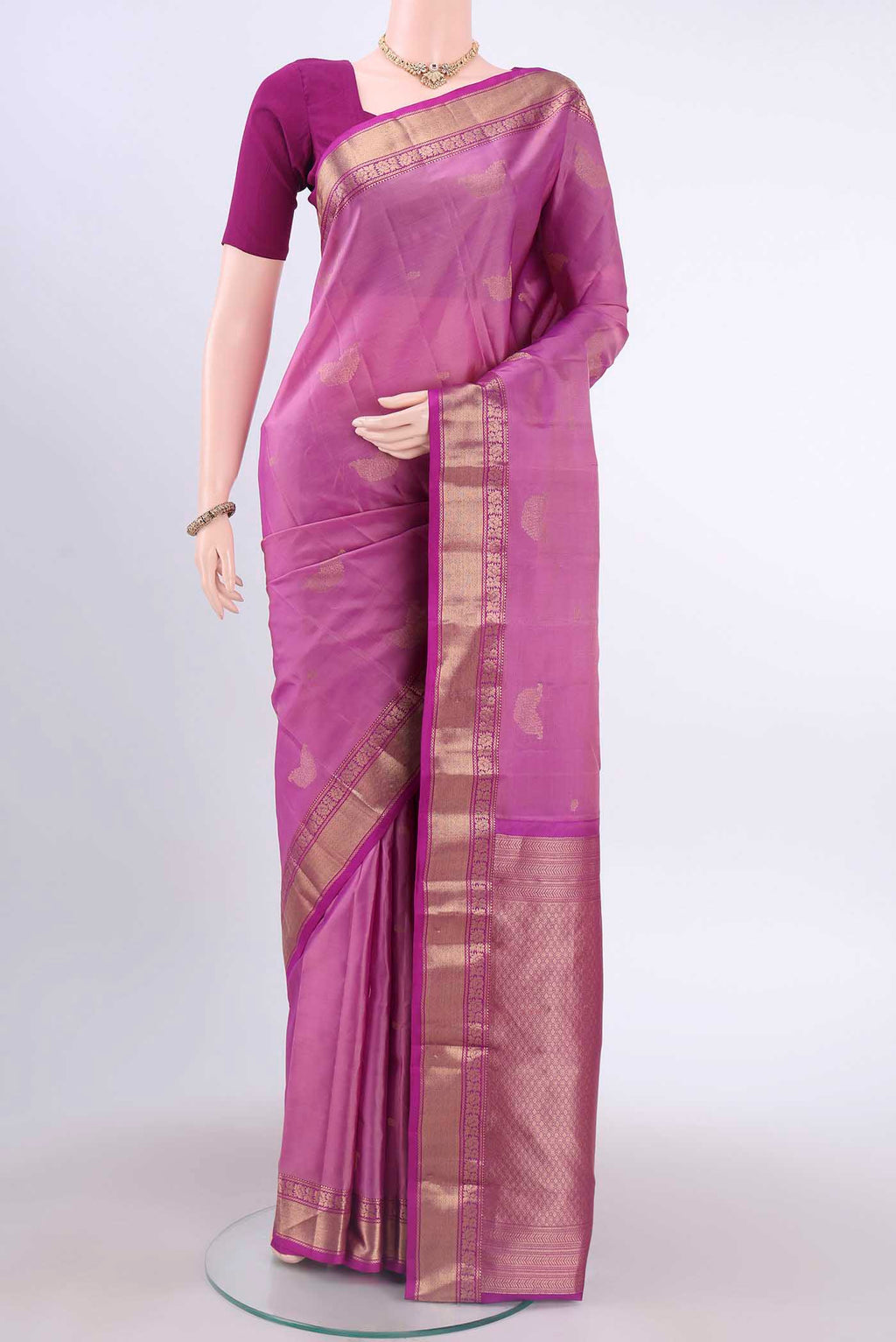 Lavender Kanchipuram Silk Saree with Zari Butta on the body and Zari Border displayed on a mannequin