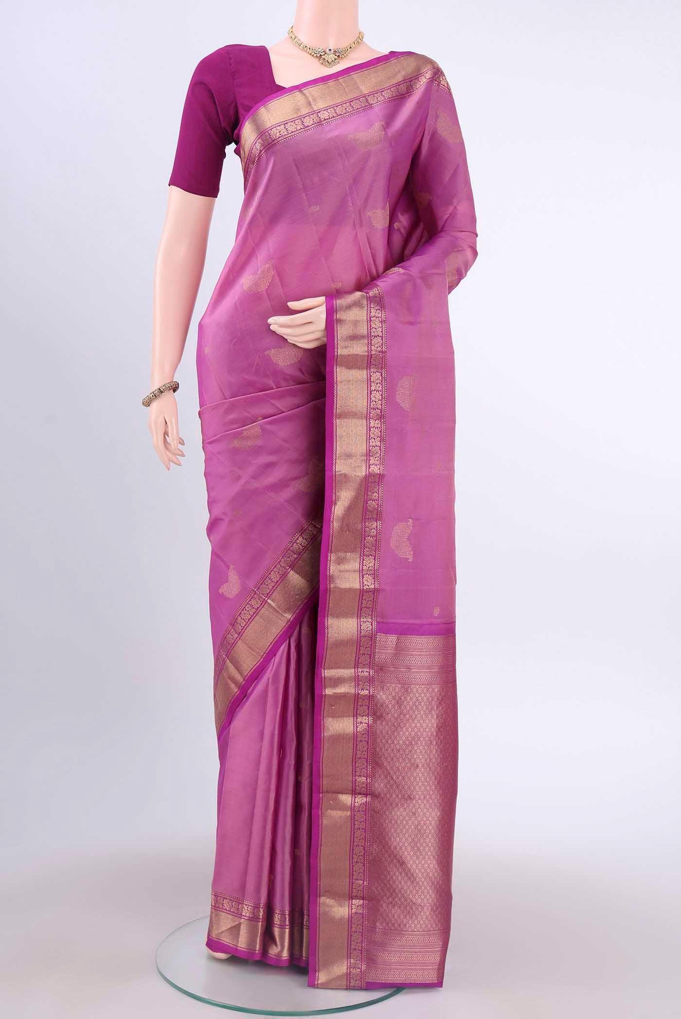 Lavender Kanchipuram Silk Saree with Zari Butta on the body and Zari Border displayed on a mannequin