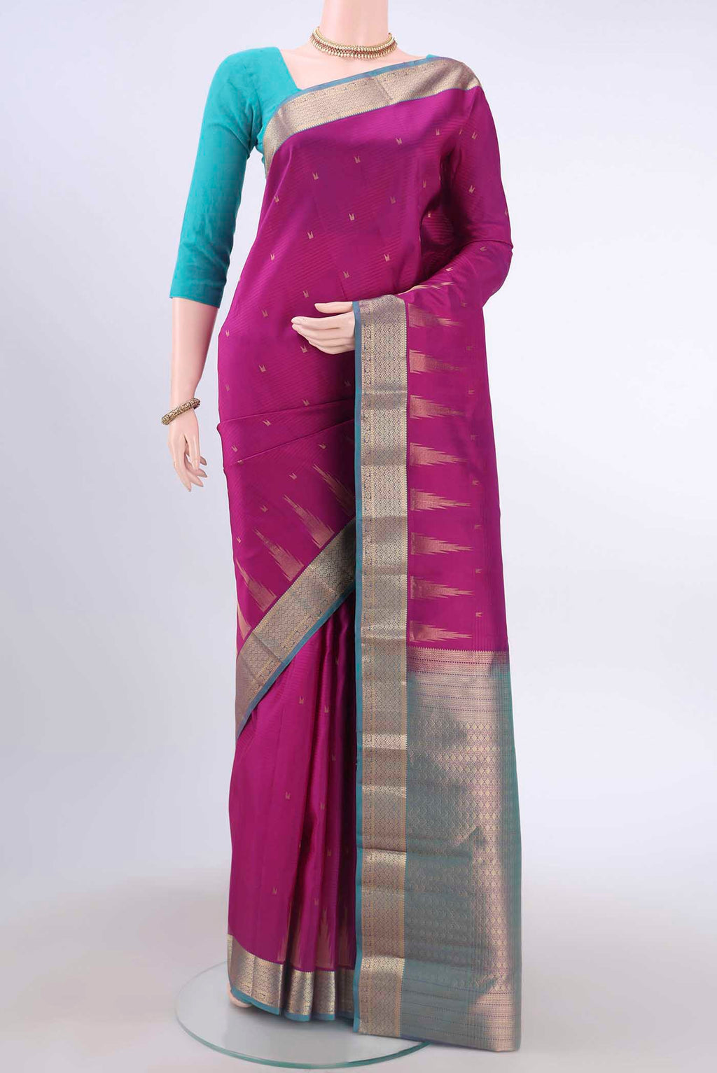 Magenta Nangavalli Silk [ Salem ] Saree with Zari Butta on the body and Zari Border displayed on a mannequin