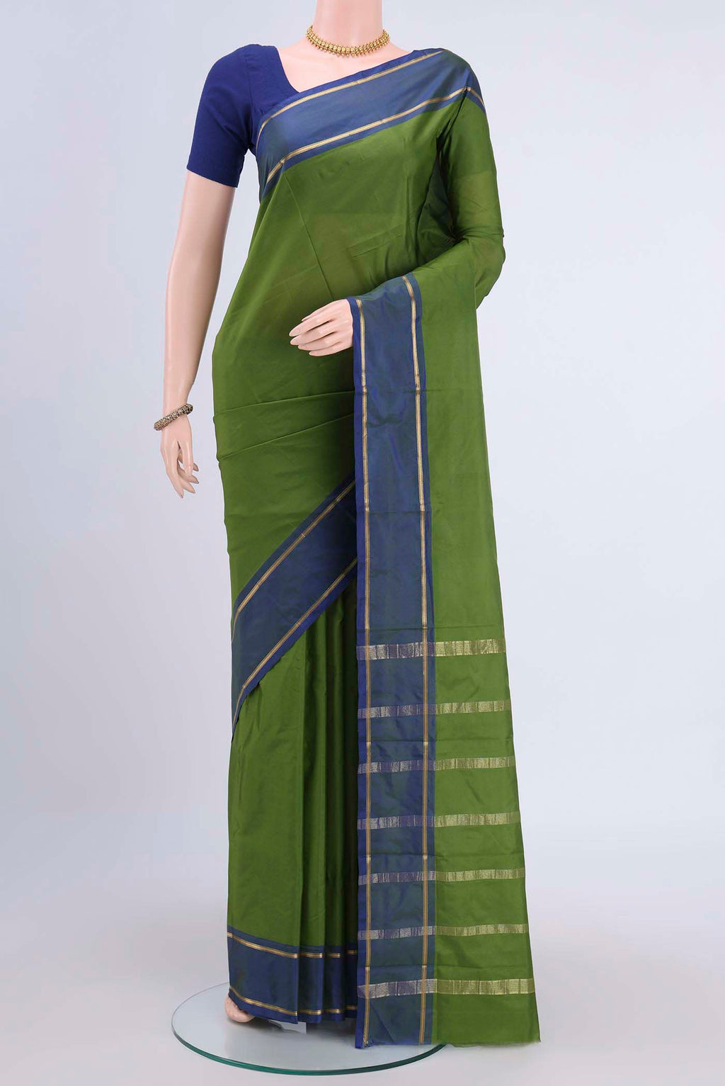 Light Green Dual Tone Blended Bangalore Silk Saree with Plain Body and Zari Border displayed on a mannequin