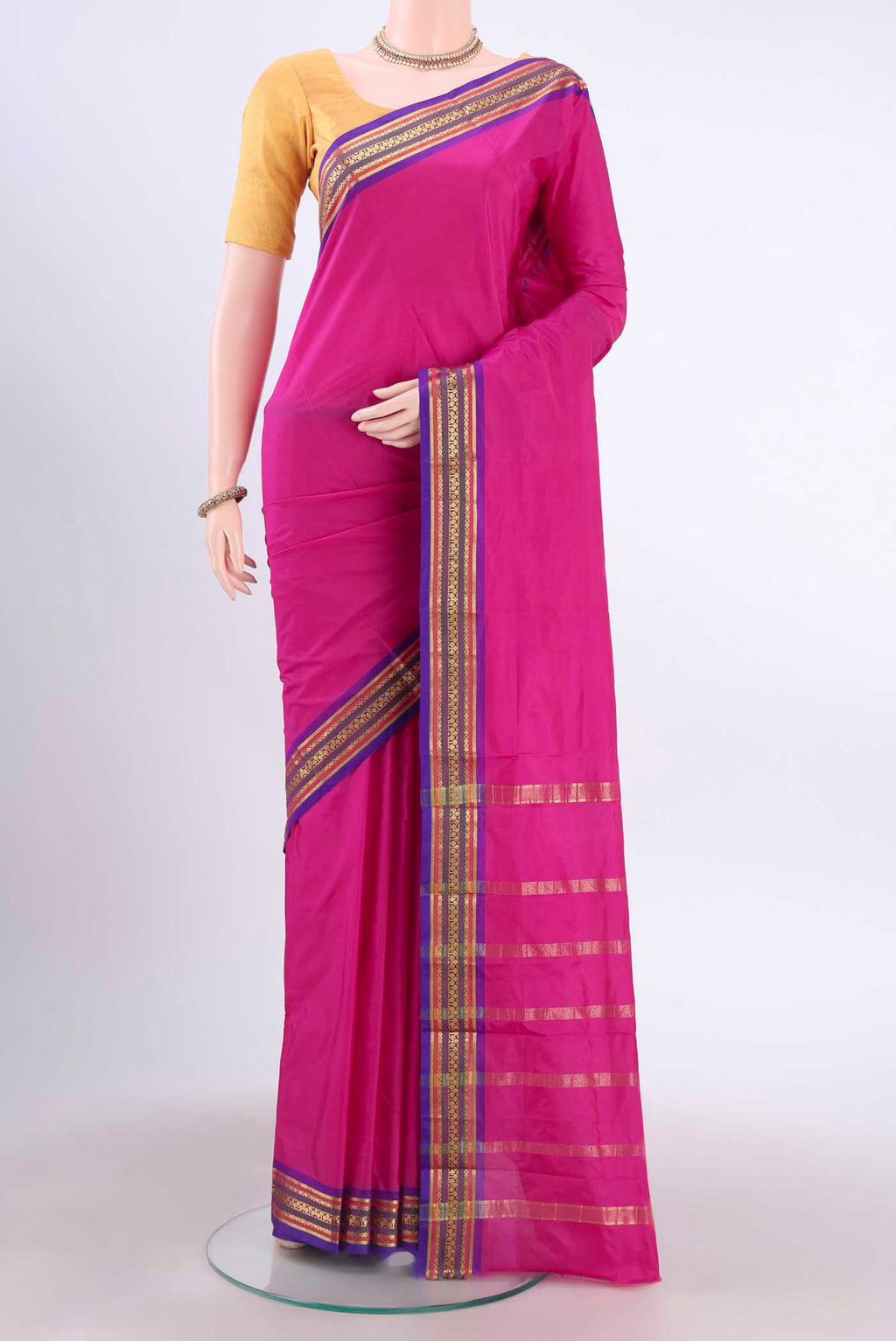 Rani Pink Dual Tone Blended Bangalore Silk Saree with Plain Body and Zari Border displayed on a mannequin