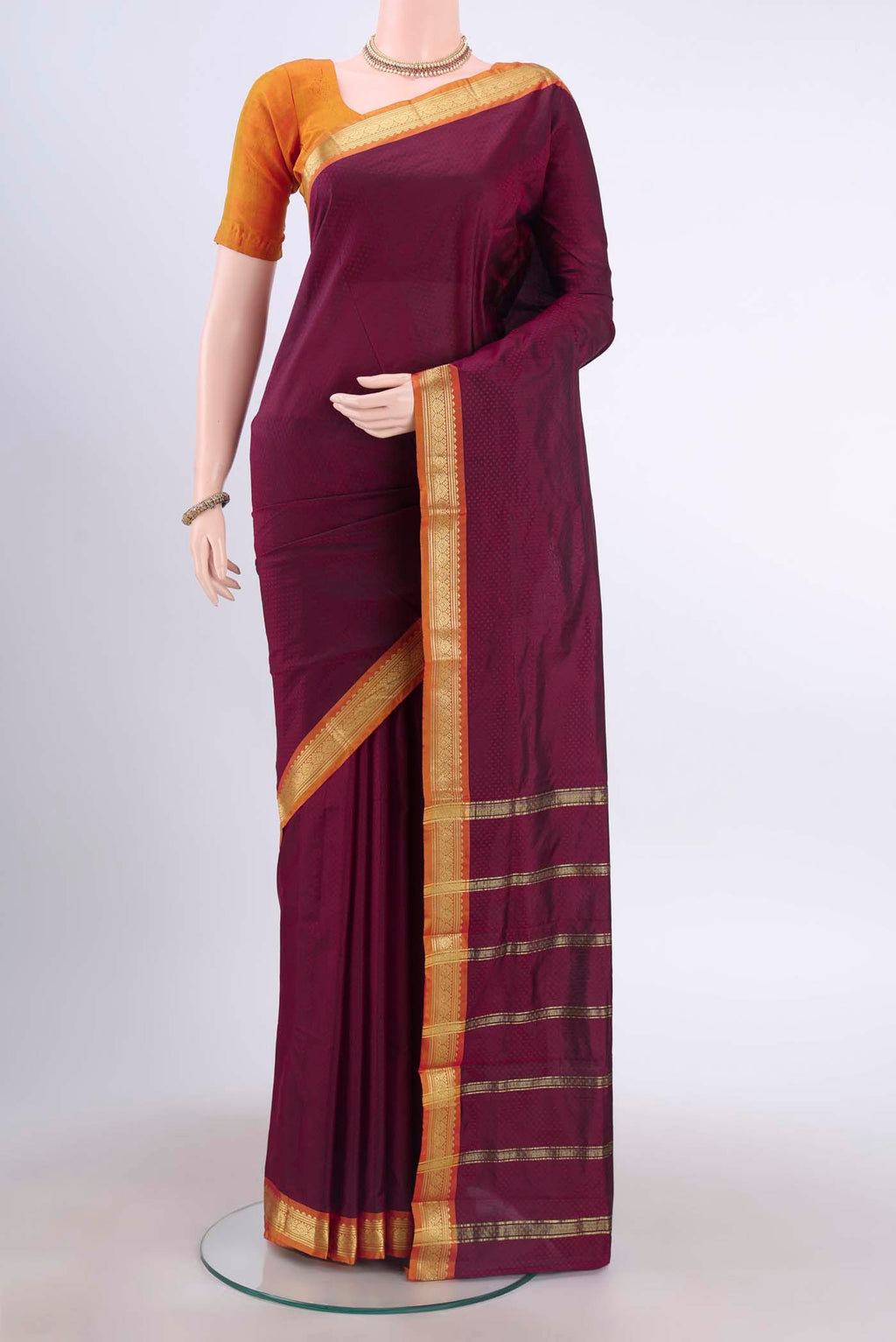 Burgundy Dual Tone Blended Bangalore Silk Saree with Jacquard design on the body and Zari Border displayed on a mannequin