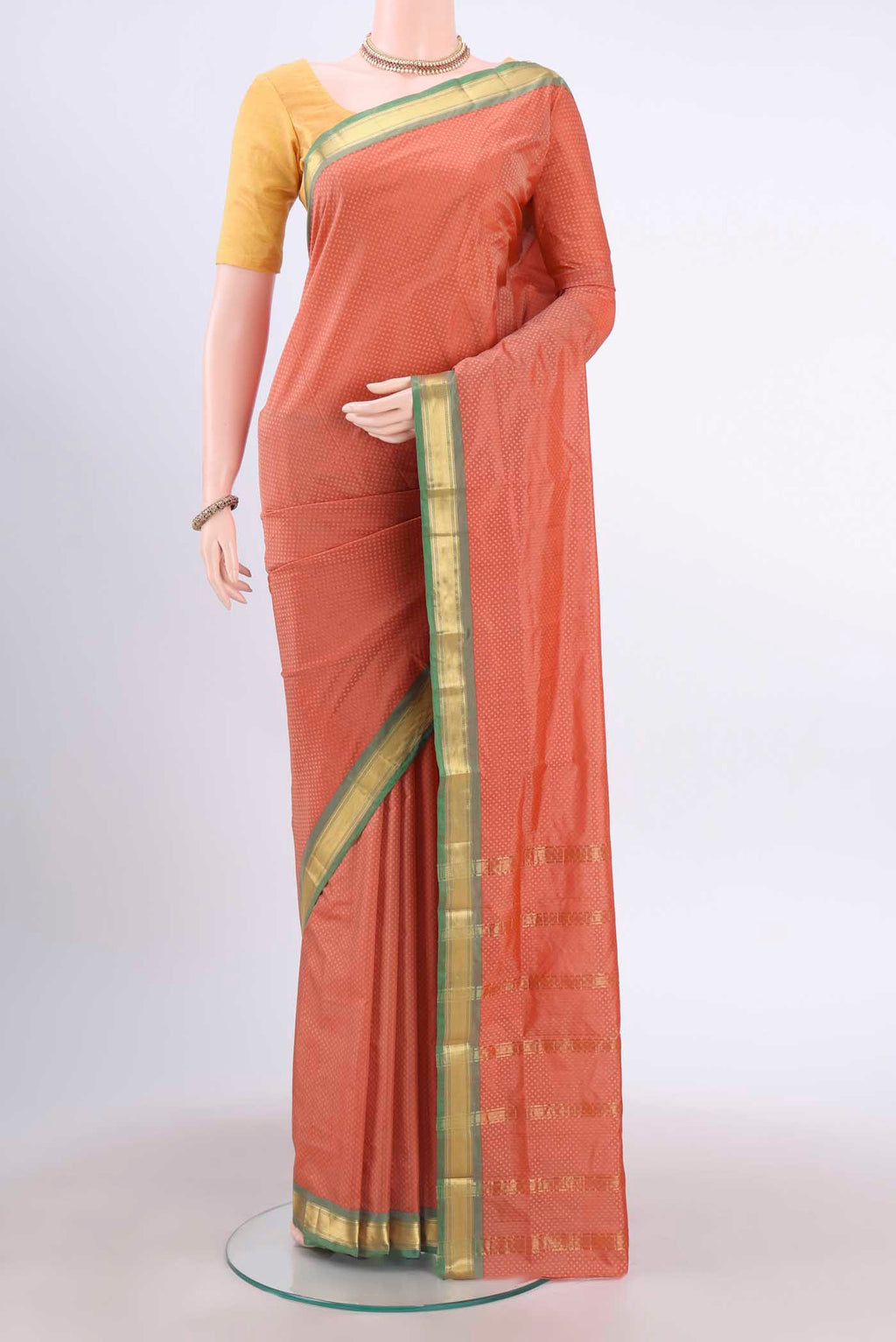 Coral Dual Tone Blended Bangalore Silk Saree with Jacquard design on the body and Zari Border displayed on a mannequin