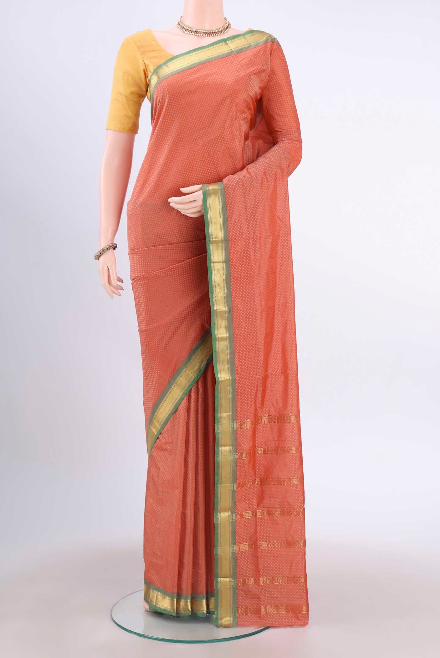 Coral Dual Tone Blended Bangalore Silk Saree with Jacquard design on the body and Zari Border displayed on a mannequin