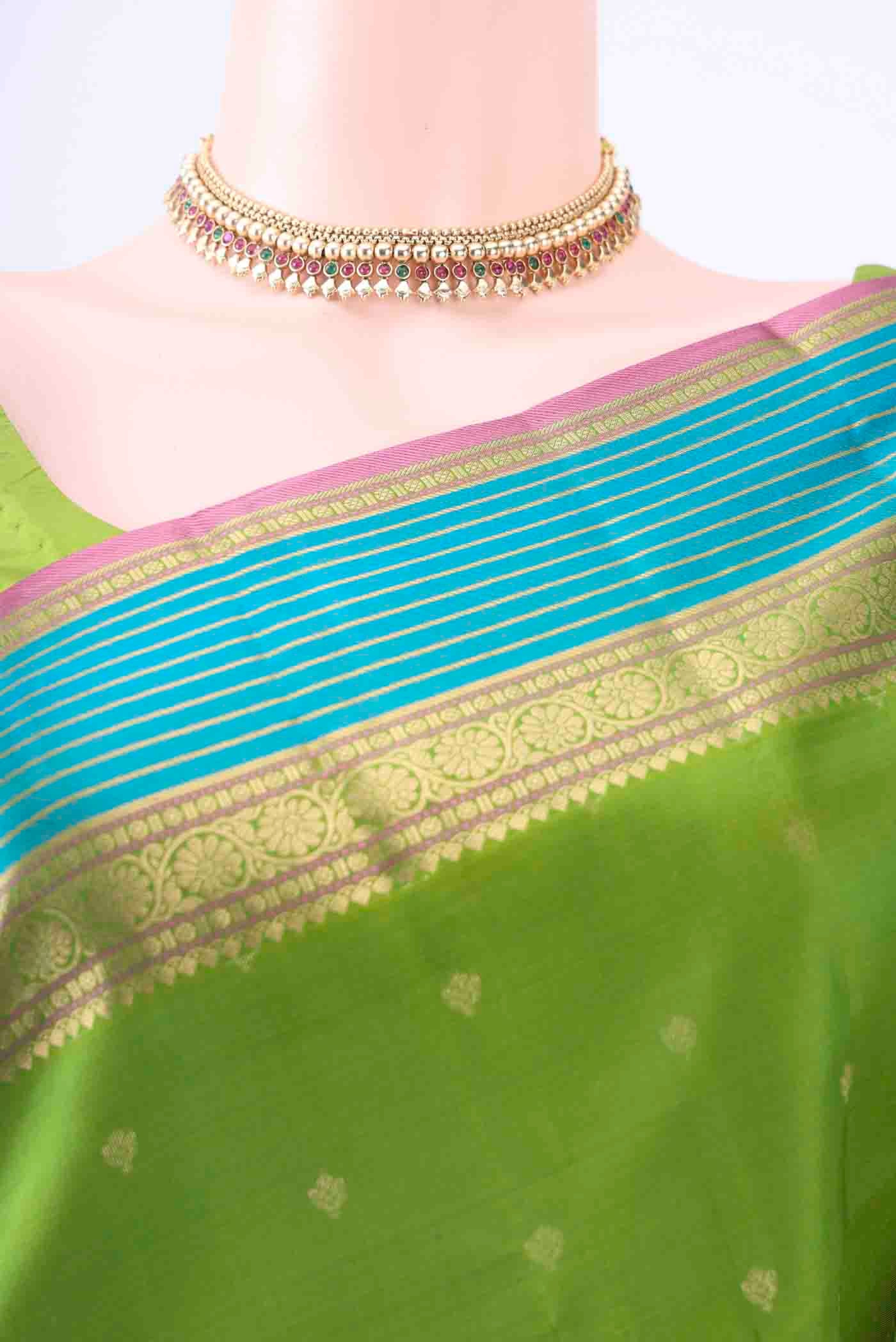 Border image of Green Kanchipuram Silk Saree with Zari Butta on the body and Zari Border