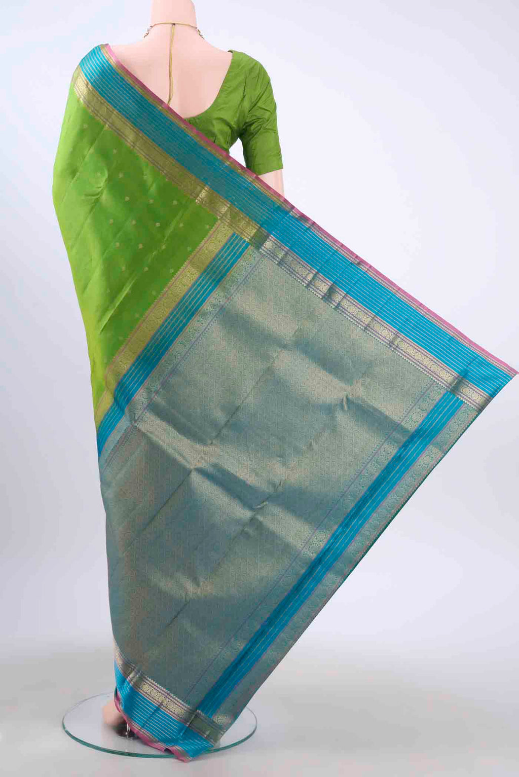 Flat view of Green Kanchipuram Silk Saree with Zari Butta on the body and Zari Border