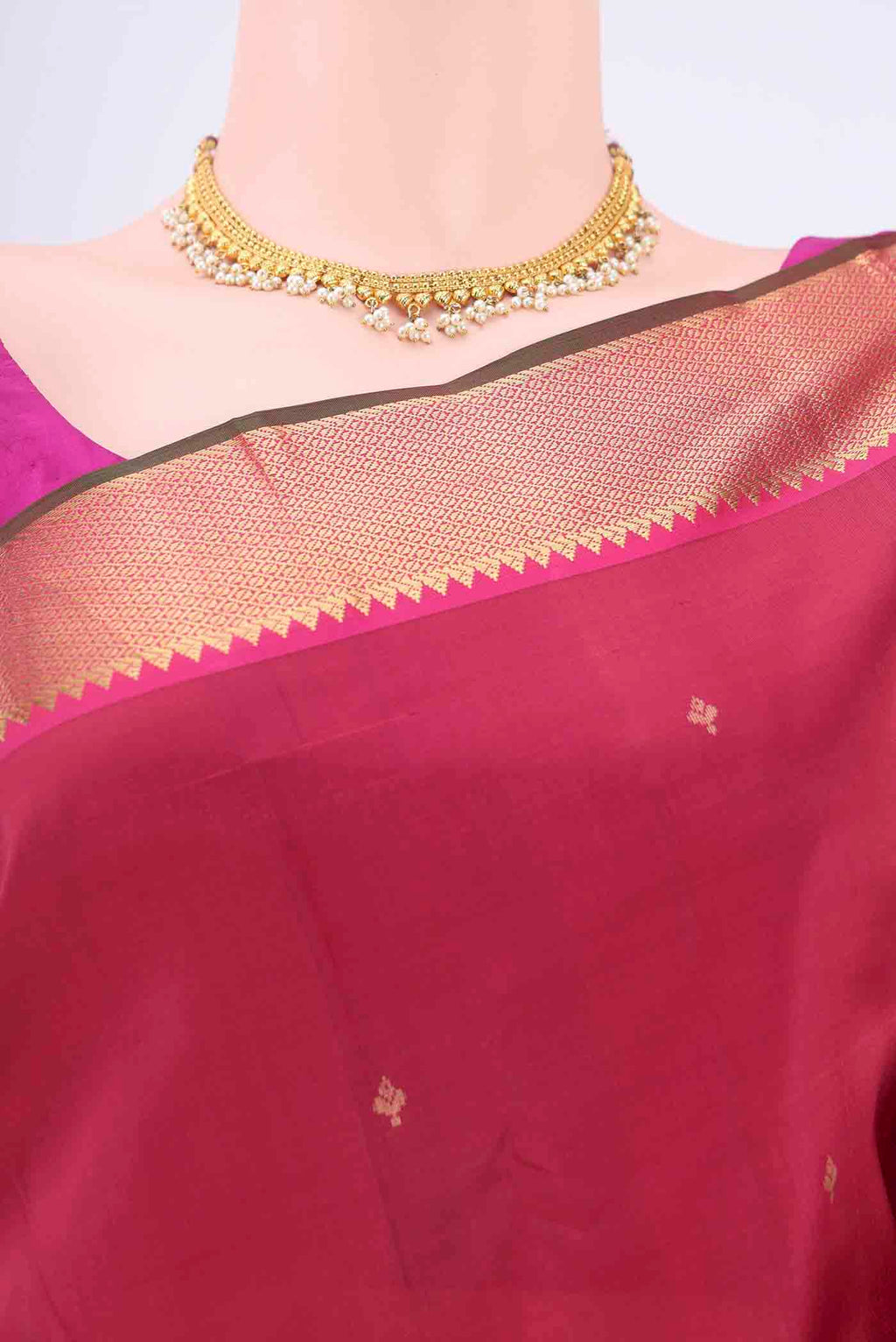 Border image of Maroon Kanchipuram Silk Saree with Zari Butta on the body and Zari Border