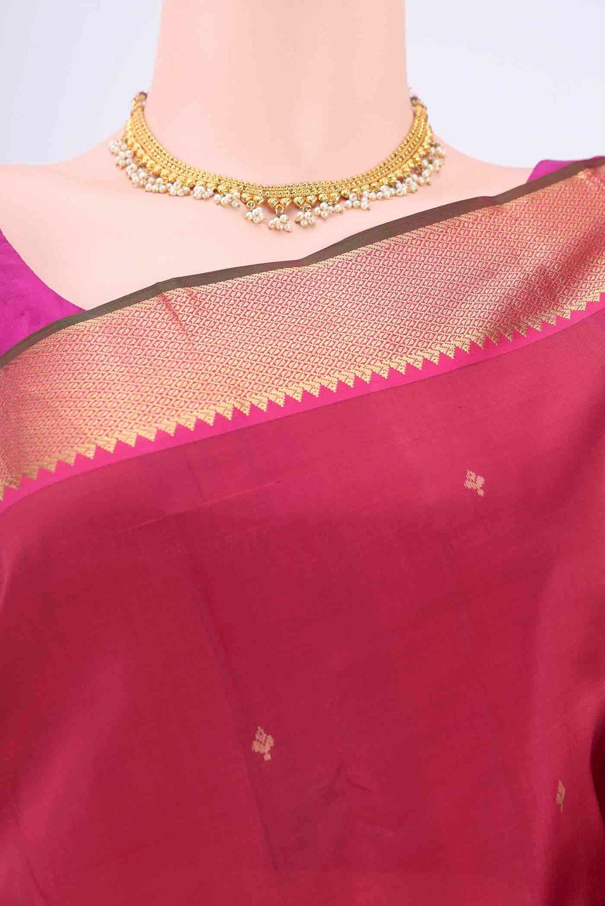 Border image of Maroon Kanchipuram Silk Saree with Zari Butta on the body and Zari Border
