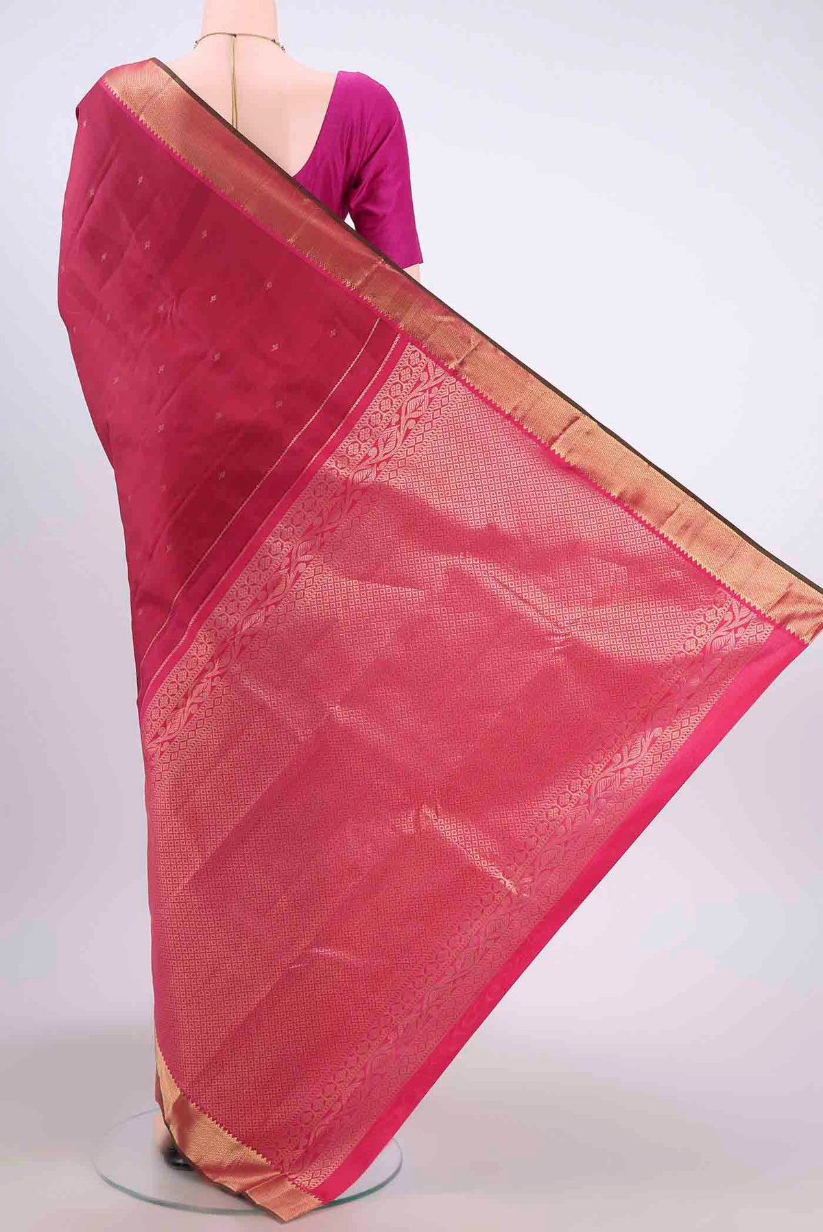Flat view of Maroon Kanchipuram Silk Saree with Zari Butta on the body and Zari Border