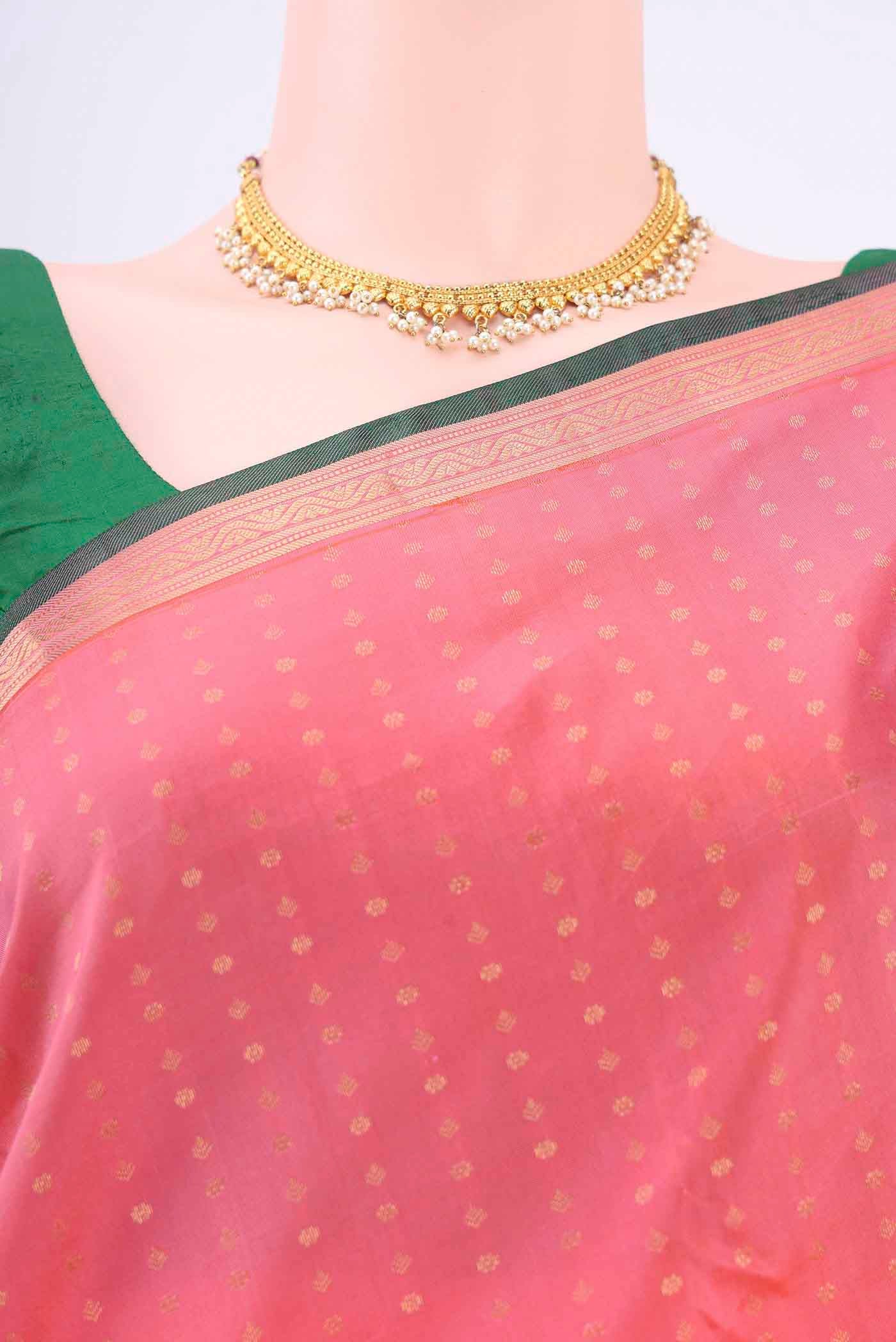 Border image of Rose pink Kanchipuram Silk Saree with Zari Butta on the body and Zari Border