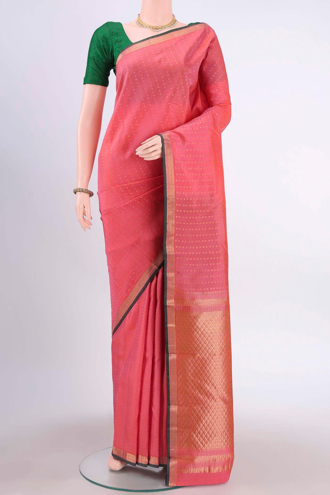 Rose pink Kanchipuram Silk Saree with Zari Butta on the body and Zari Border displayed on a mannequin
