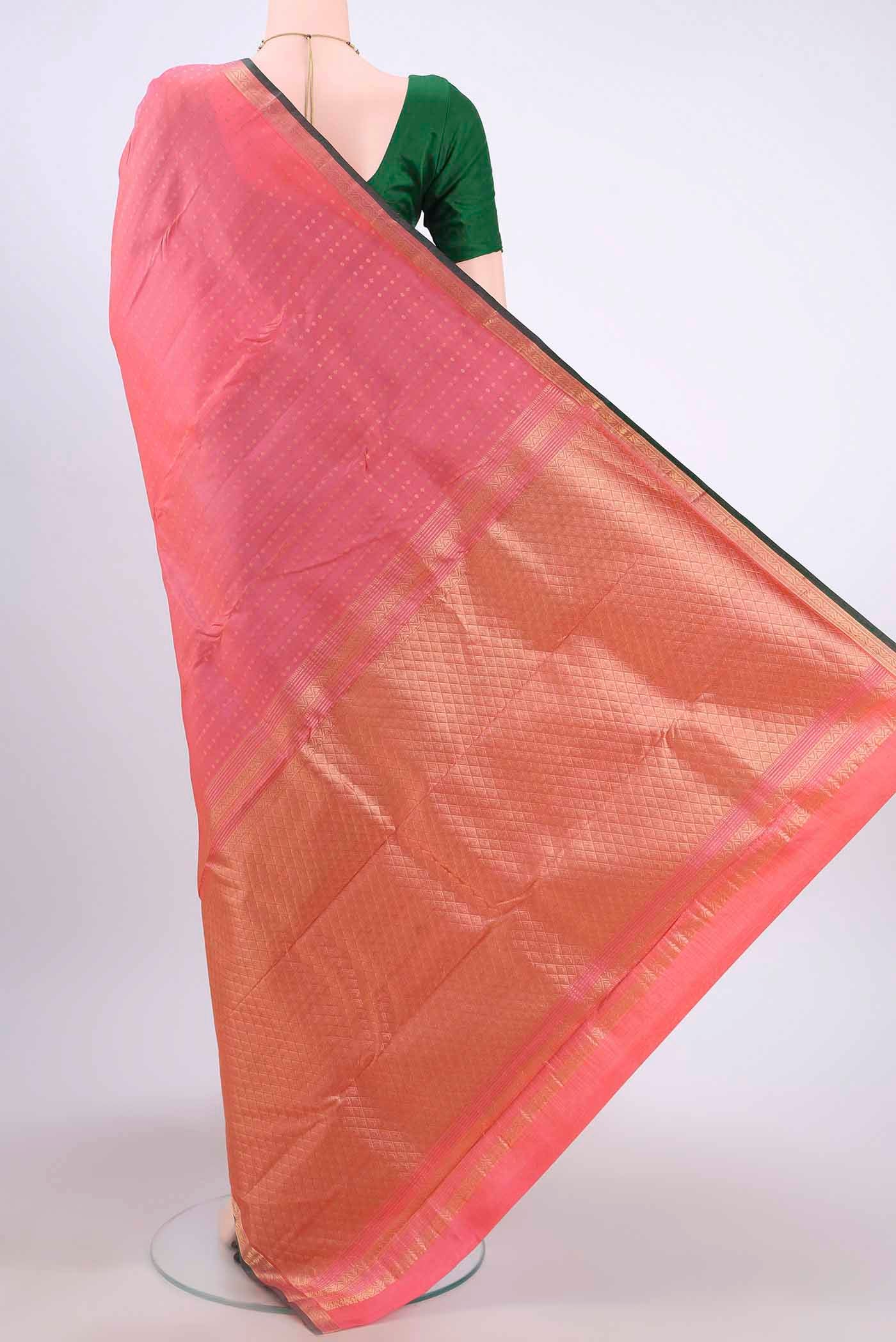 Flat view of Rose pink Kanchipuram Silk Saree with Zari Butta on the body and Zari Border