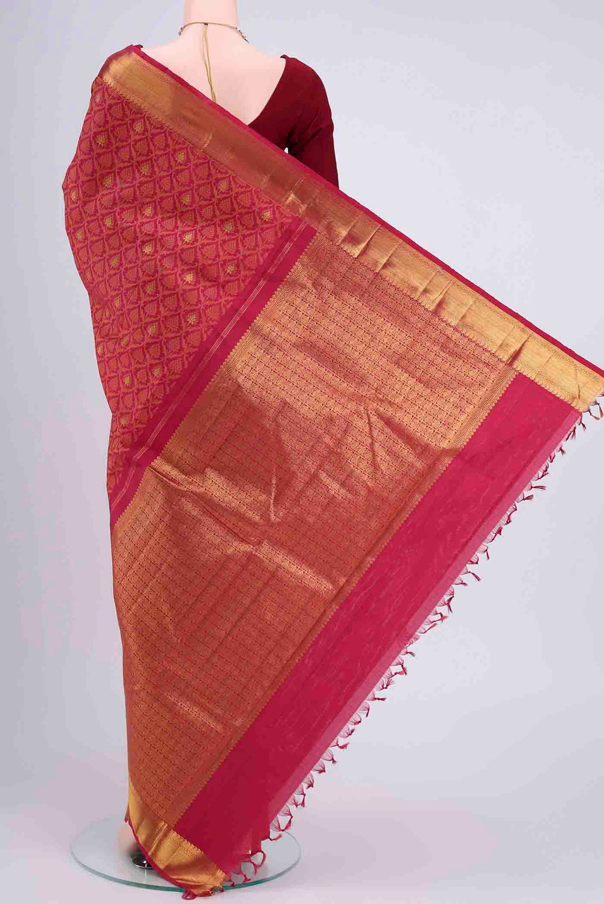 Flat view of Maroon Kanchipuram Saree with Jacquard With Zari Butta on the body and Thread Border