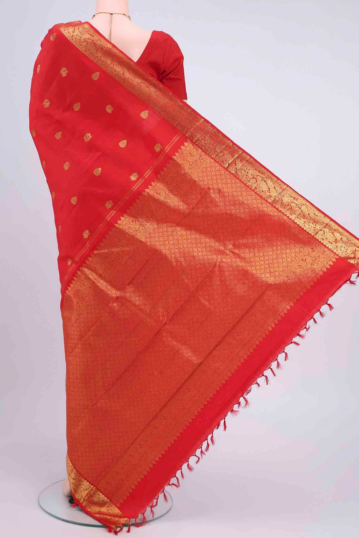 Flat view of Imperial Red Kanchipuram Saree with Zari Butta on the body and Zari Border