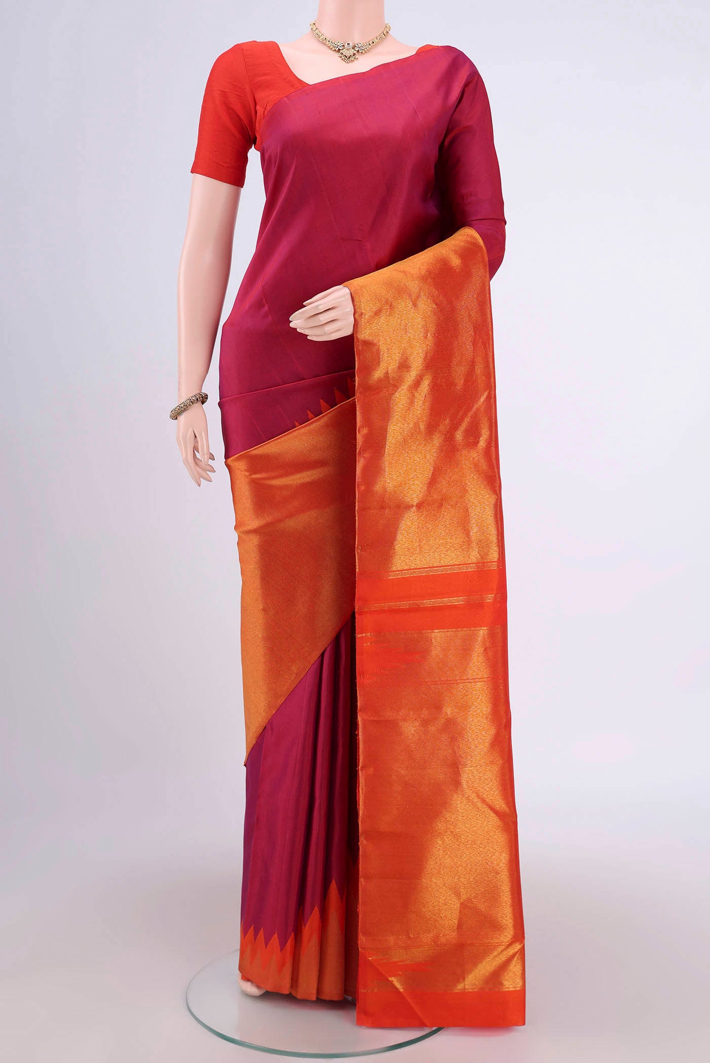 Magenta Dual Tone Soft Silk Saree with Half And Half on the body and Rising Temple Border.  displayed on a mannequin