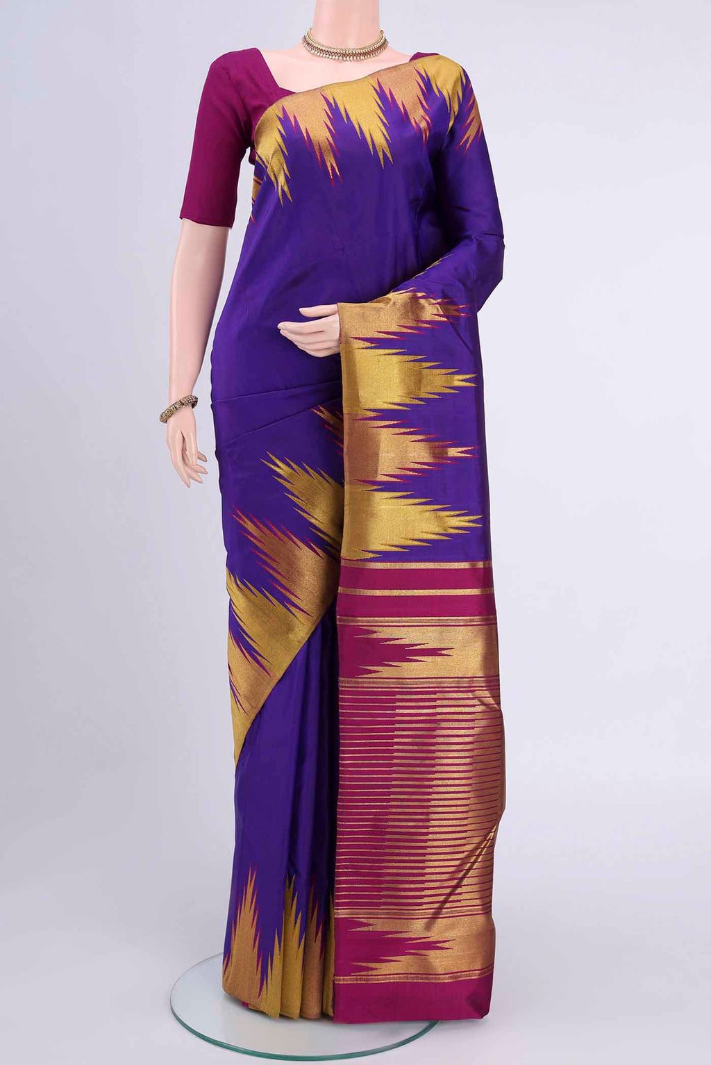 Purple Kanchipuram Saree with Plain Body and Temple Border displayed on a mannequin