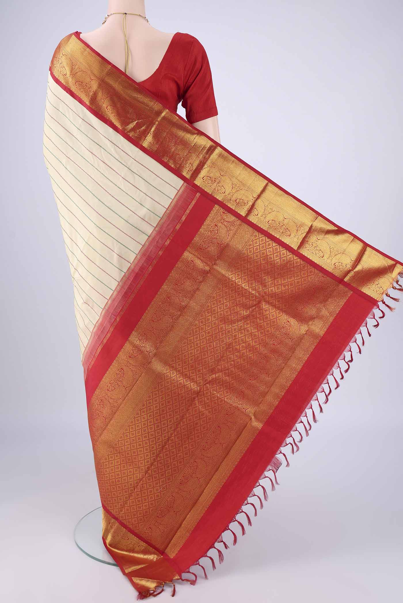 Flat view of Beige Kanjivaram Silk Saree with Veldhari on the body and Zari Border. 
