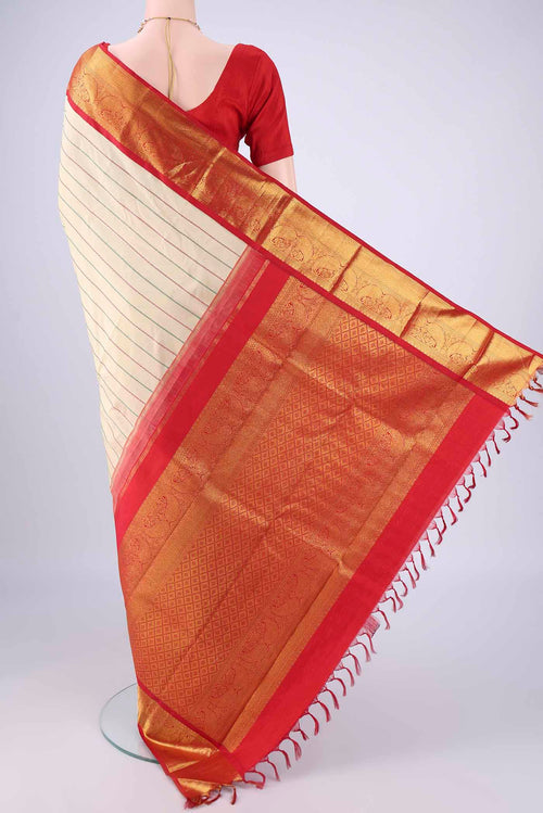 Flat view of Beige Kanjivaram Silk Saree with Veldhari on the body and Zari Border. 
