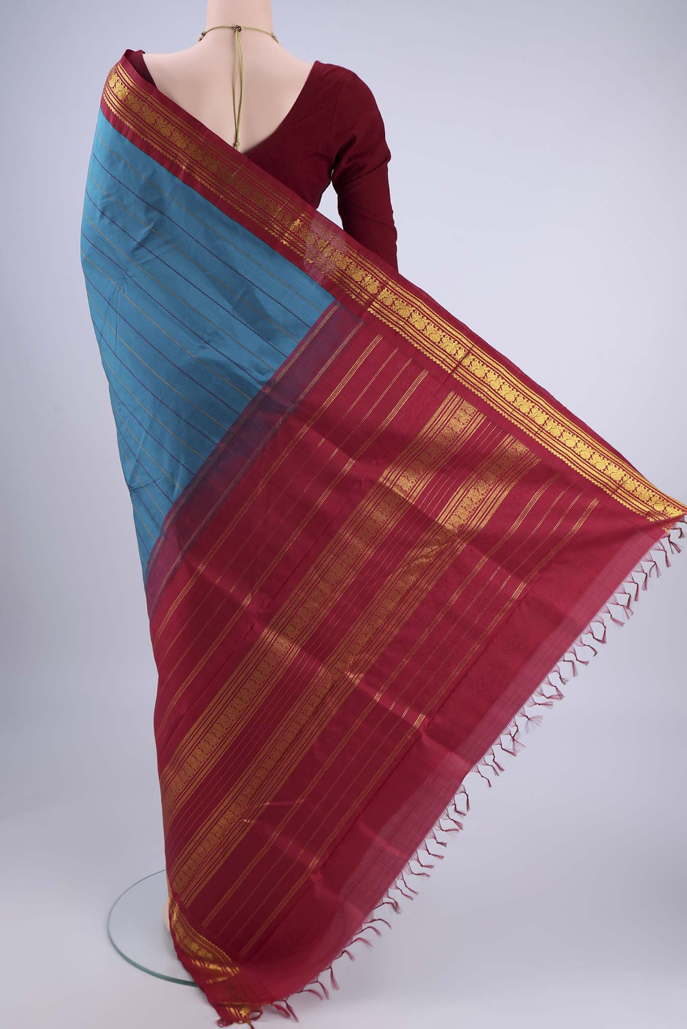 Flat view of Blue Kanchipuram Silk Saree with Veldhari on the body and Zari Border. 