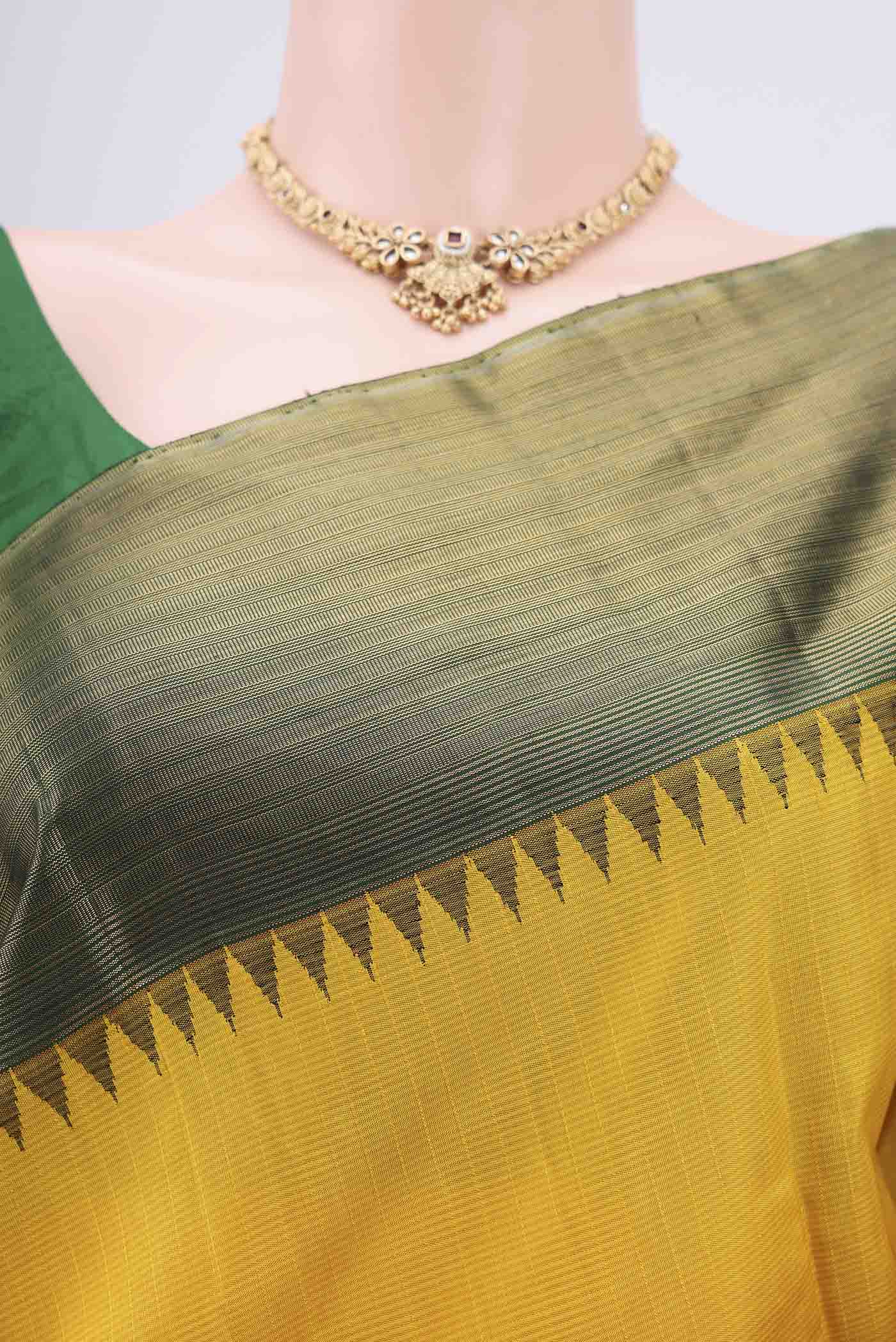 Border image of Yellow Kanjivaram Silk Saree with Stripes on the body and Attached Border. 