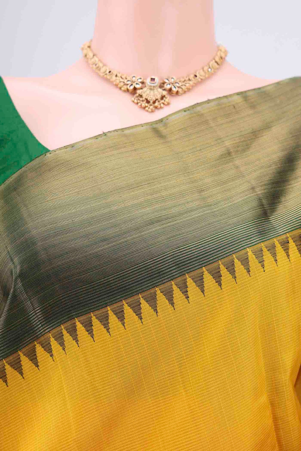 Border image of Yellow Kanjivaram Silk Saree with Stripes on the body and Attached Border. 