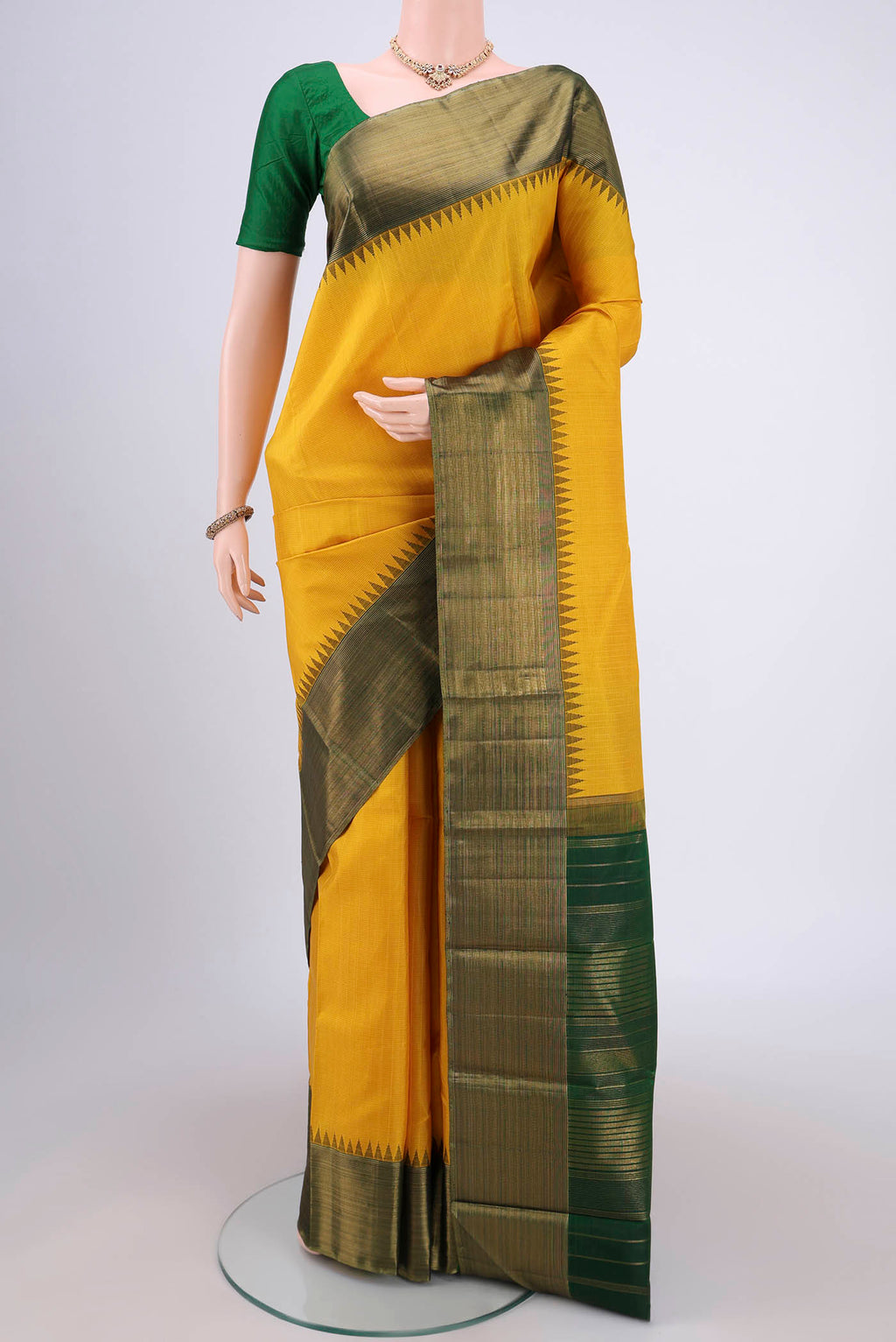 Yellow Kanjivaram Silk Saree with Stripes on the body and Attached Border.  displayed on a mannequin