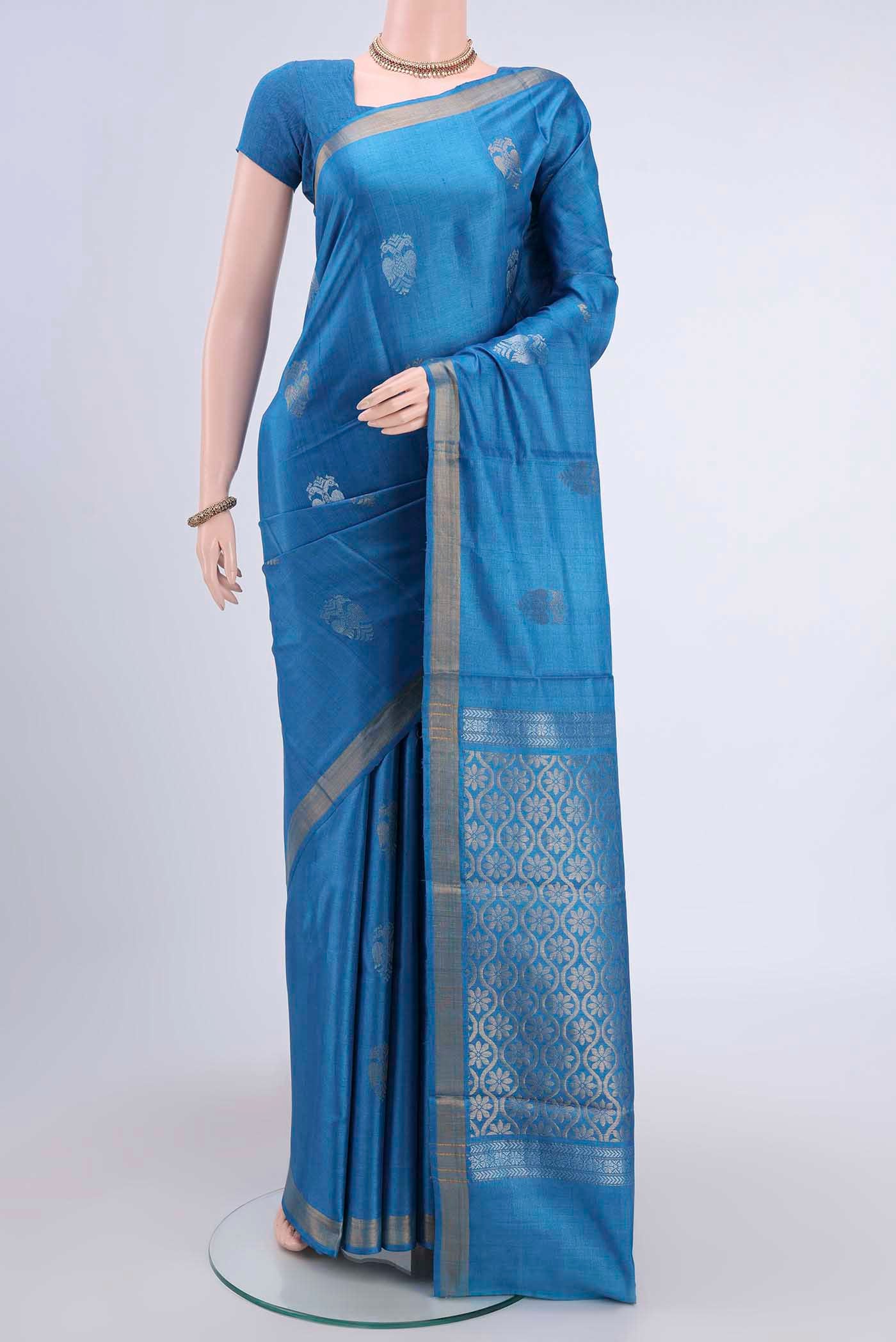 Blue Tussar Silk Saree with Zari Butta on the body and Zari Border displayed on a mannequin