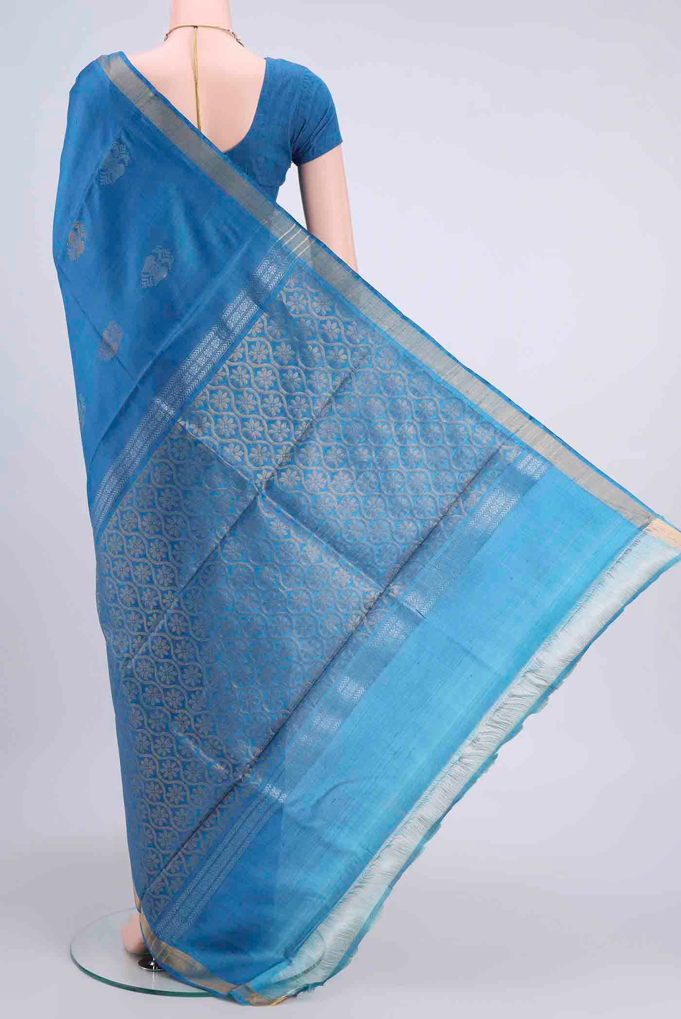 Flat view of Blue Tussar Silk Saree with Zari Butta on the body and Zari Border
