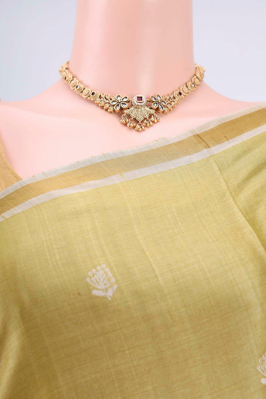 Border image of Sage Green Tussar Silk Saree with Zari Butta on the body and Zari Border. 