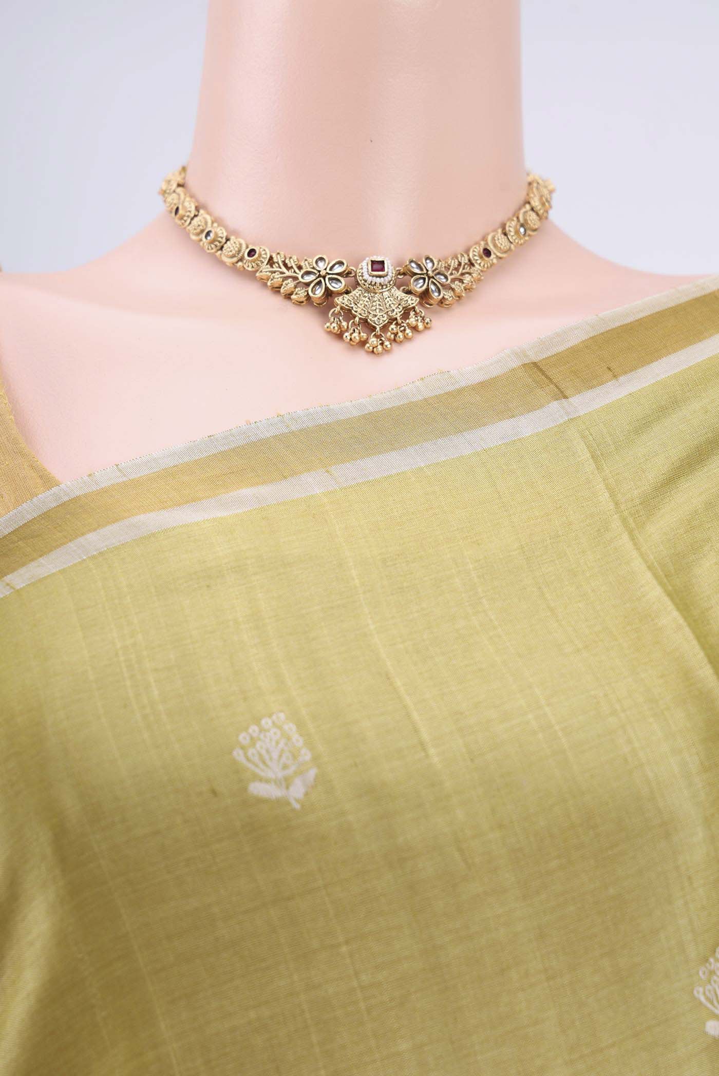 Border image of Sage Green Tussar Silk Saree with Zari Butta on the body and Zari Border. 