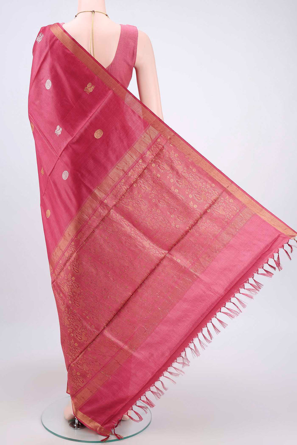 Flat view of Dark Pink Tussar Silk Saree with Zari Butta on the body and Zari Border. 