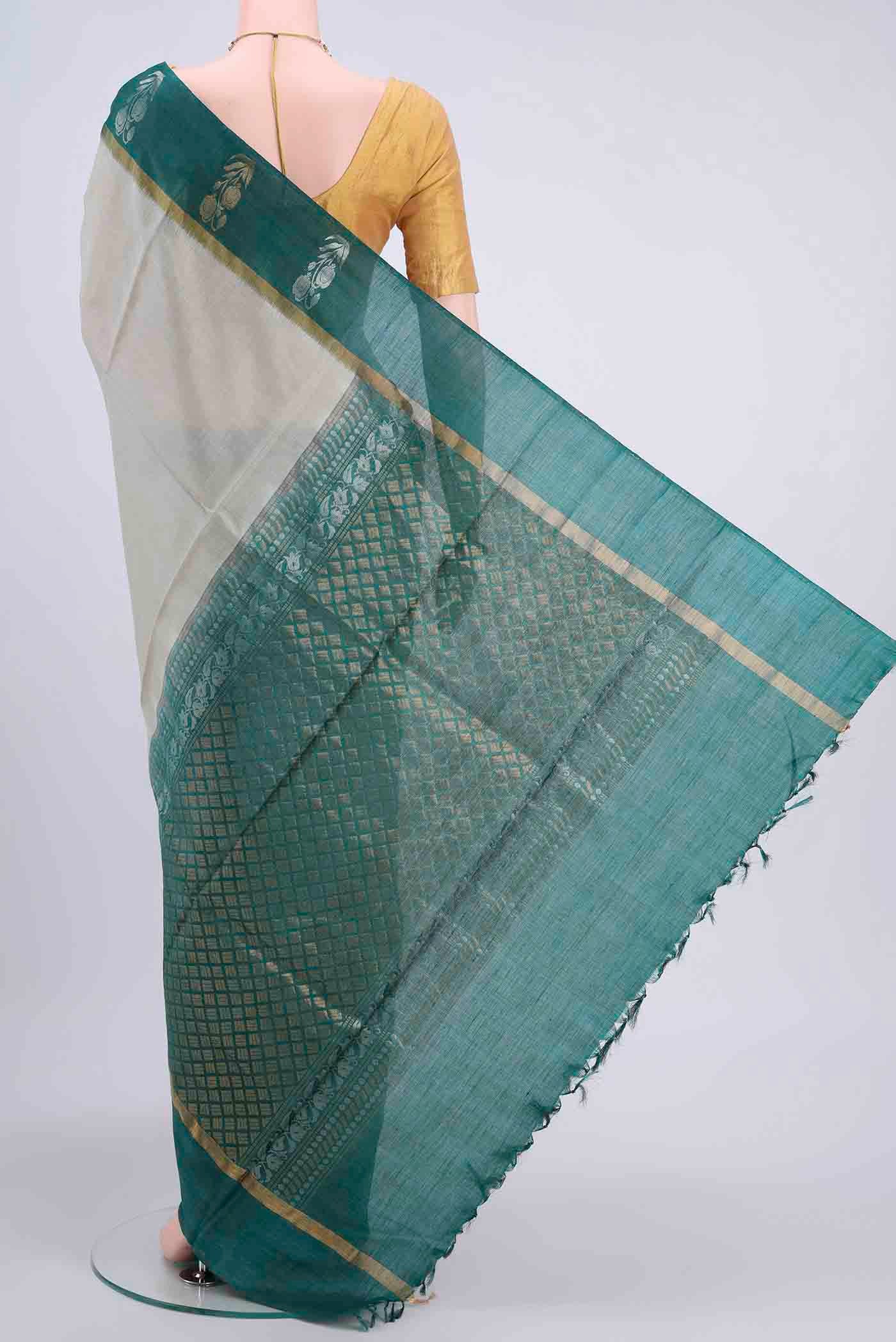 Flat view of Beige Tussar Silk Saree with Plain Body and Zari Border