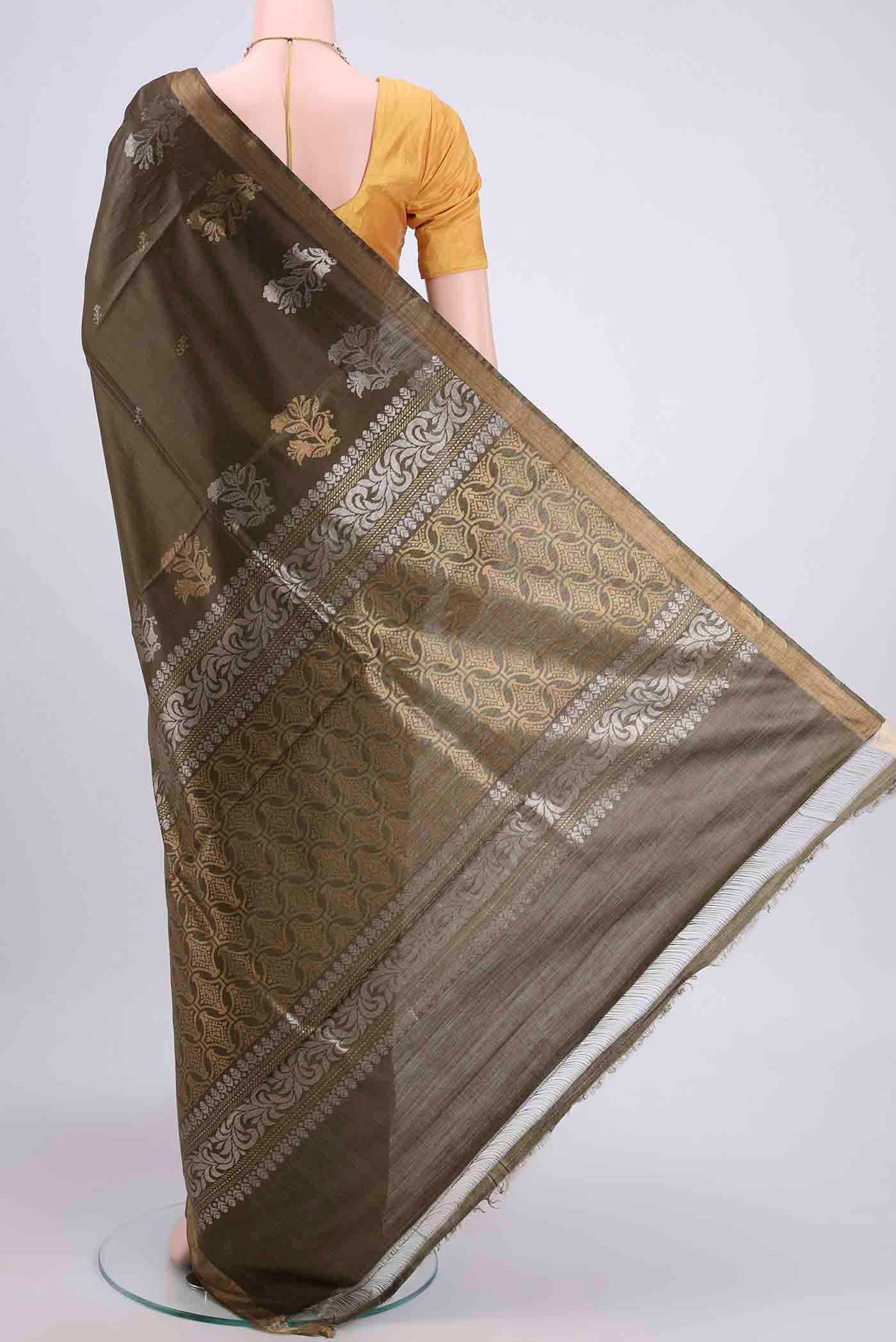 Flat view of Mehandi Green Tussar Silk Saree with Zari Butta on the body and Zari Border