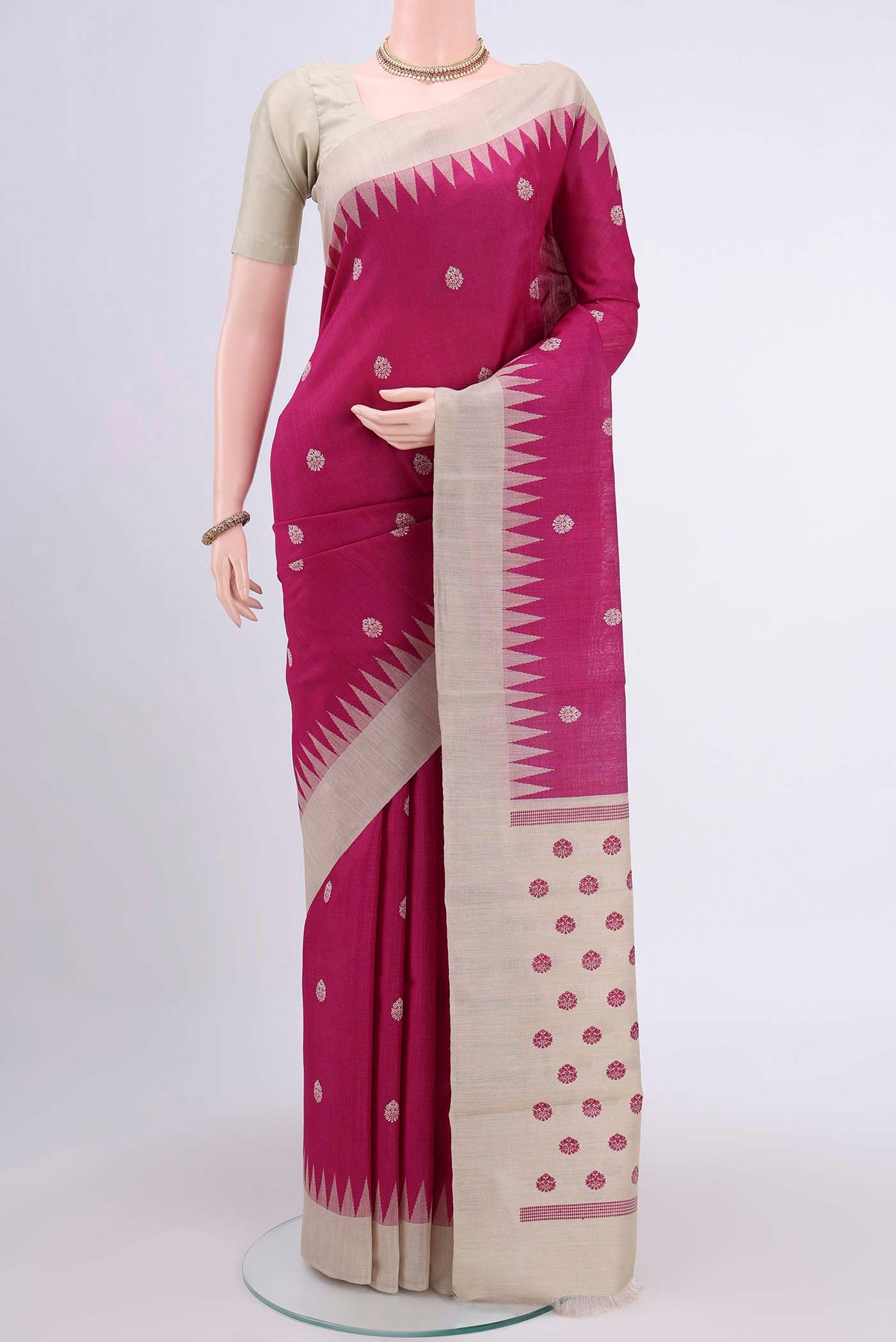 Rani Pink Tussar Silk Saree with Thread Butta on the body and Zari Border displayed on a mannequin