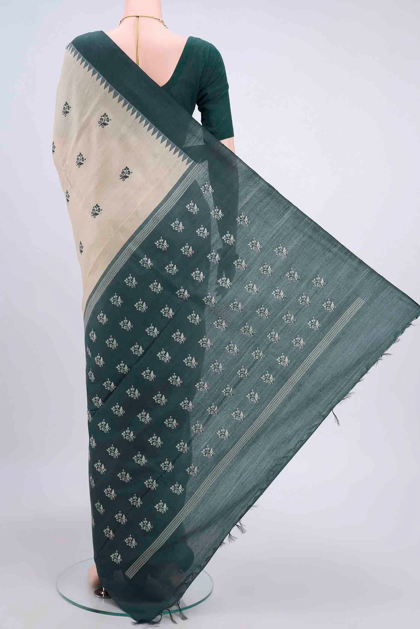 Flat view of Beige Tussar Silk Saree with Embroidery on the body and Temple Border