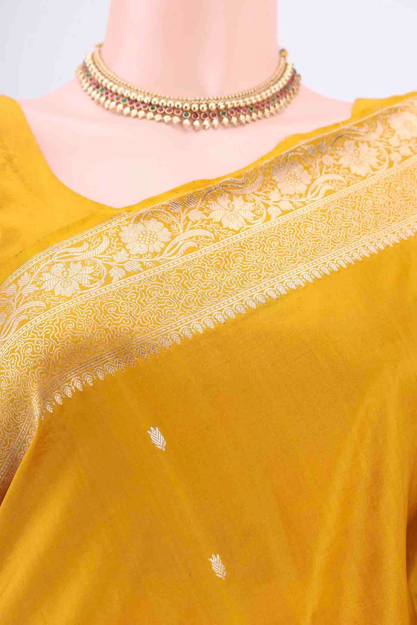 Border image of Yellow Banarasi Katan Silk Saree with Zari Butta on the body and Zari Border