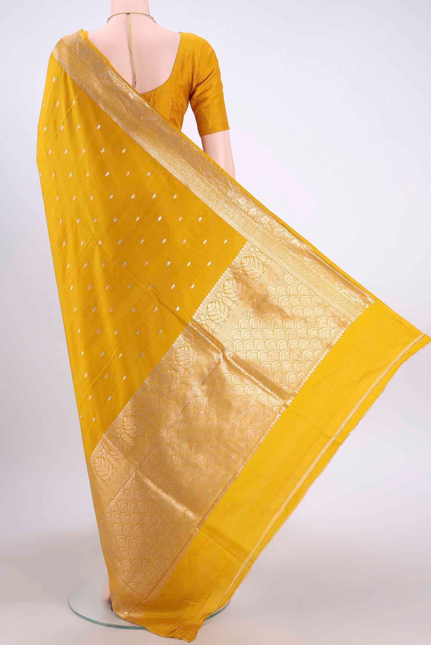 Flat view of Yellow Banarasi Katan Silk Saree with Zari Butta on the body and Zari Border