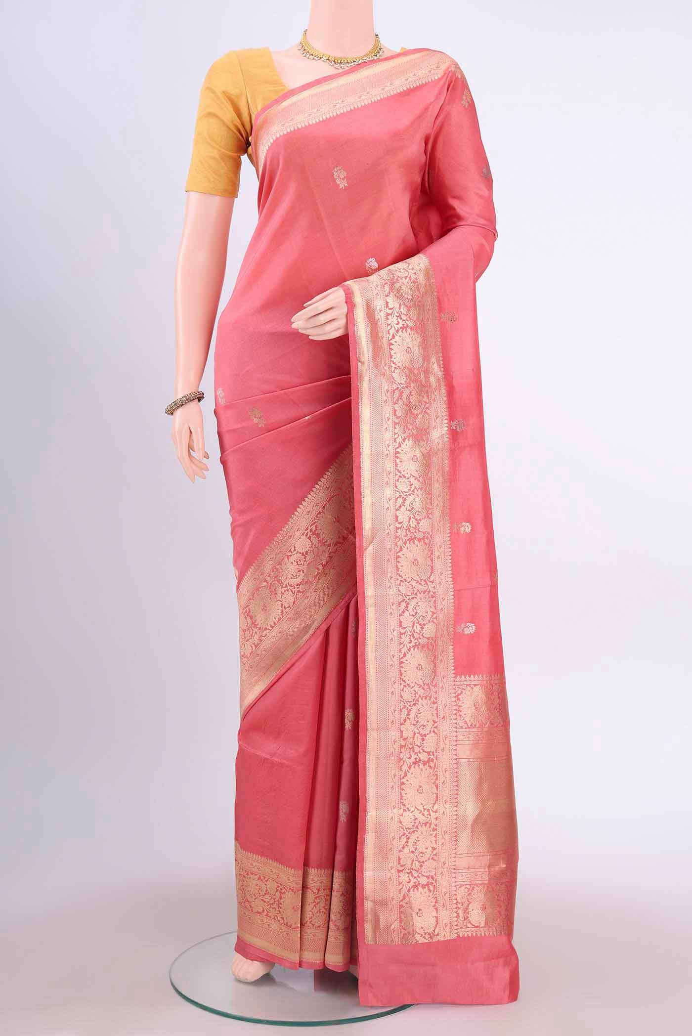 Peach Banarasi Katan Silk Saree with Zari Butta on the body and Silk Border displayed on a mannequin