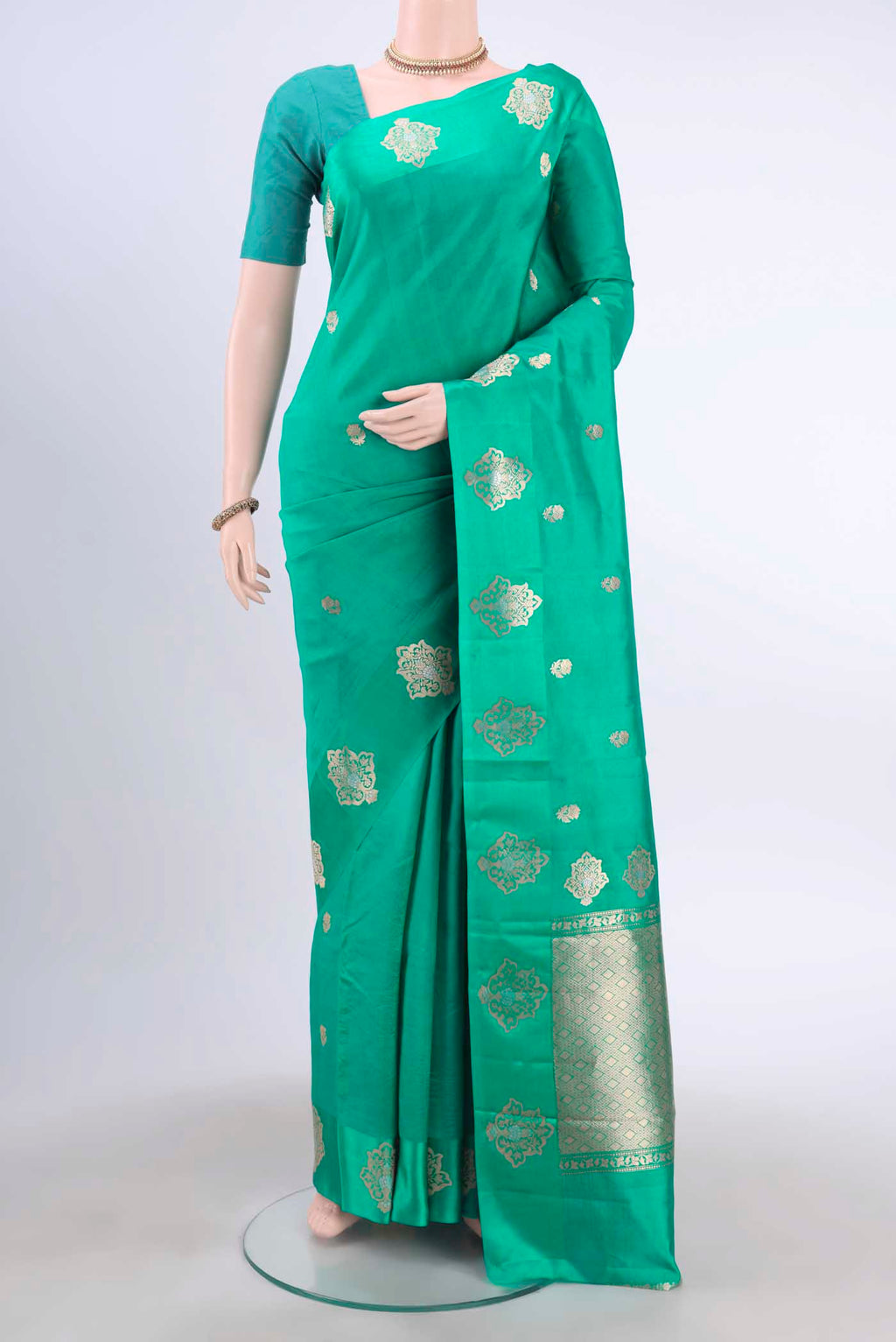Sea Green Banarasi Katan Silk Saree with Zari Butta on the body and Satin Border displayed on a mannequin