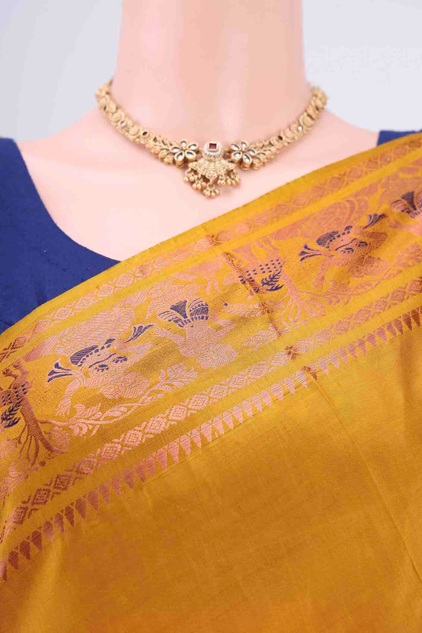 Border image of Mustard Dual Tone Baluchari Silk Saree with Zari And Thread Butta on the body and Zari Border. 