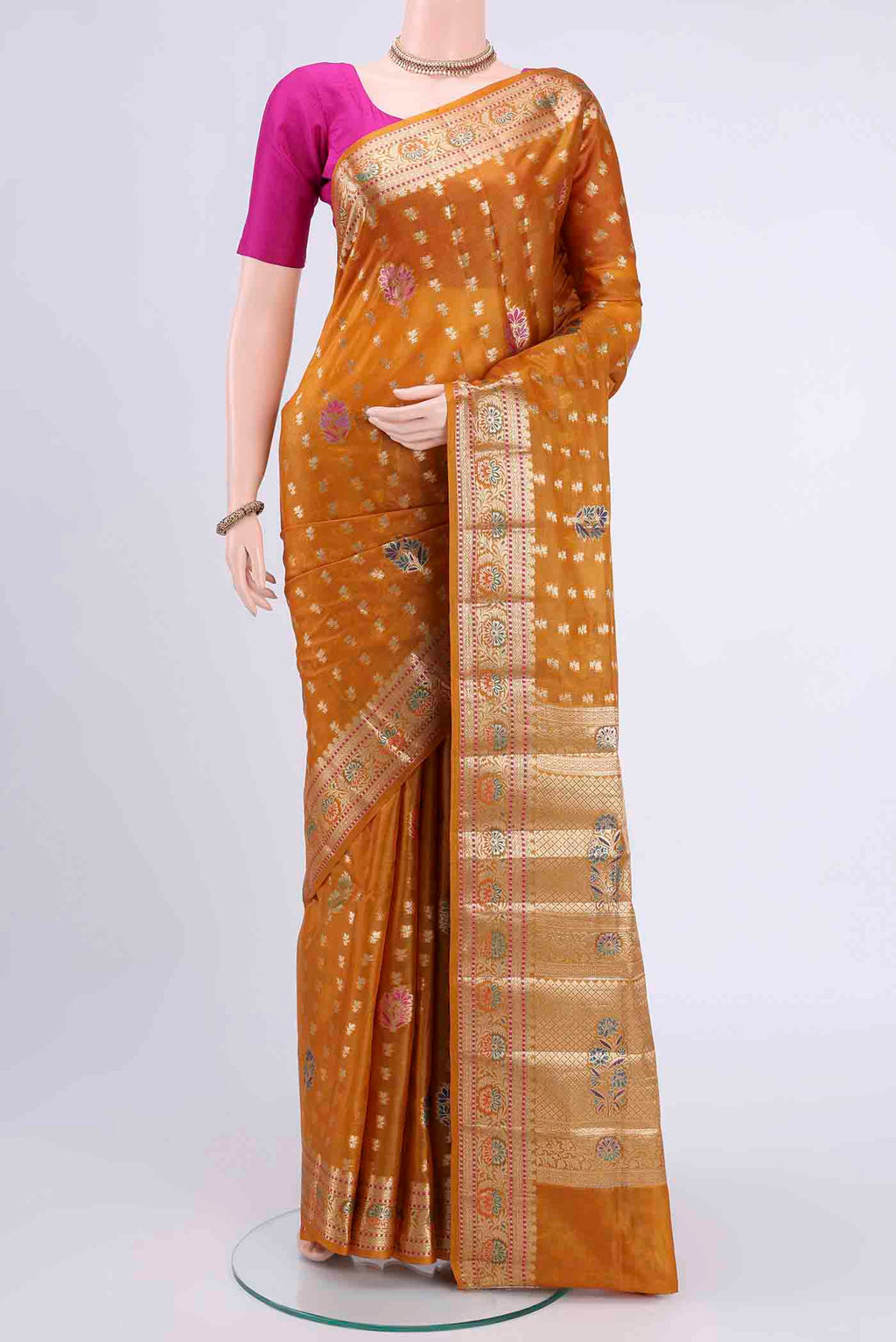 Mustard Banarasi Tussar Silk Saree with Zari Butta on the body and Zari Border displayed on a mannequin